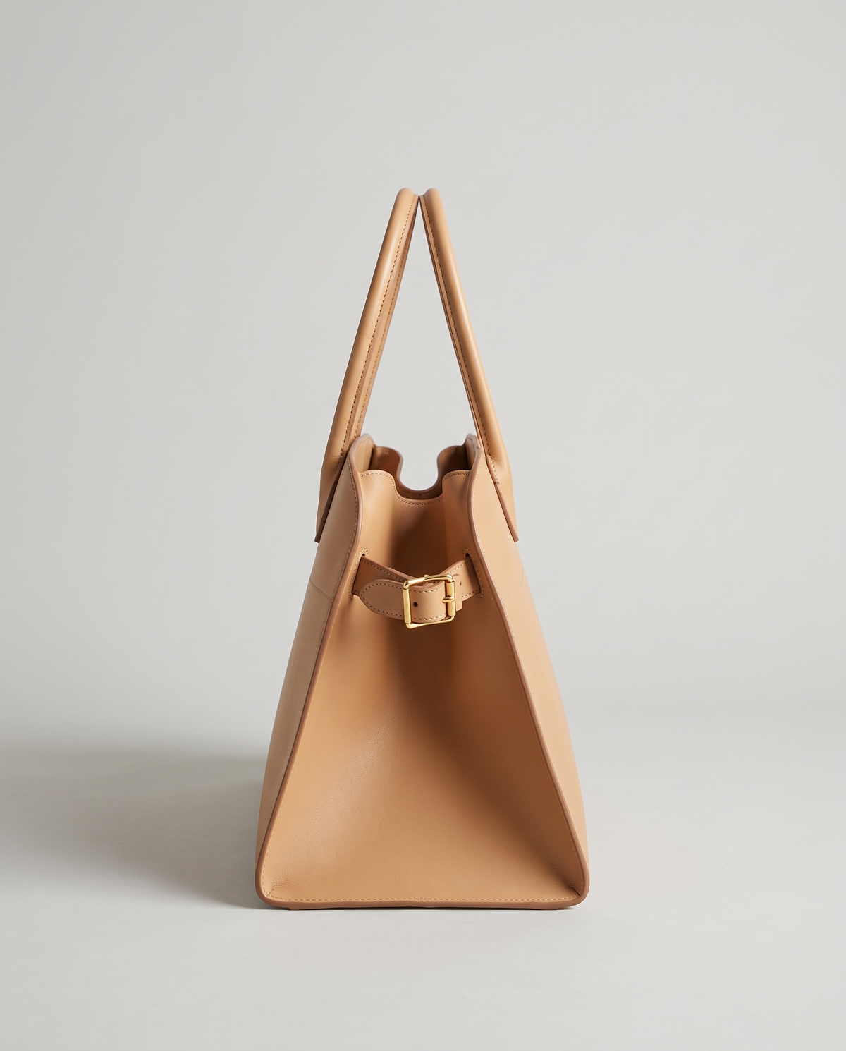 Milano Small top-handle bag in Tan – side view showing the buckled side strap