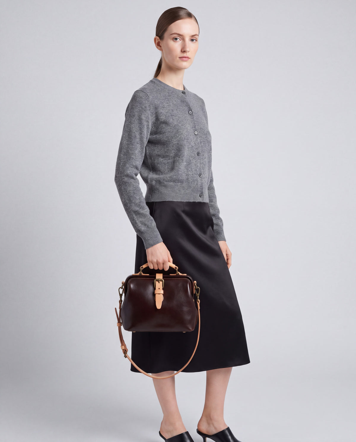 Mini Leather Bag bag in Coffee – worn by model, close-up
