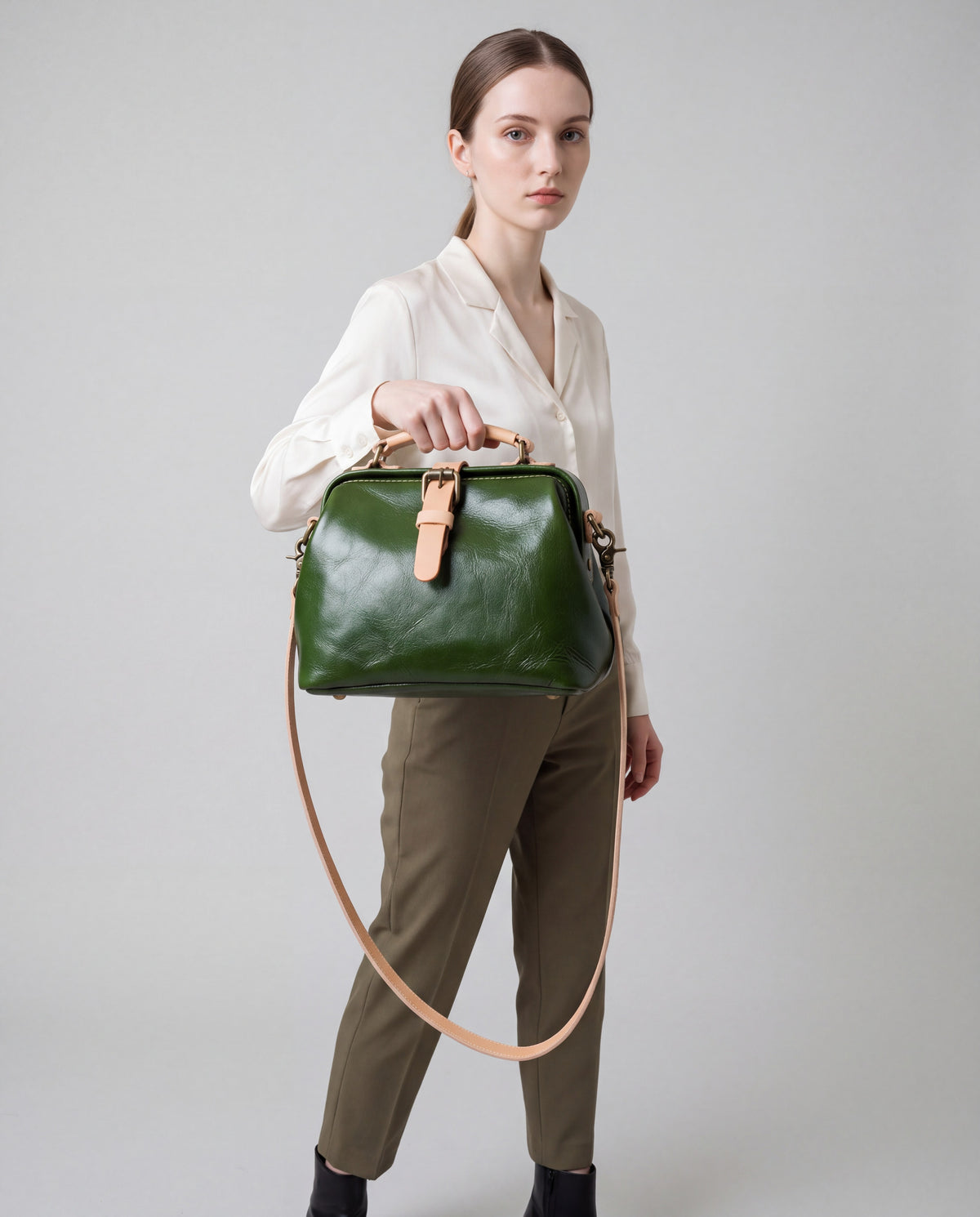 Mini Leather Bag bag in Green – worn by model, close-up