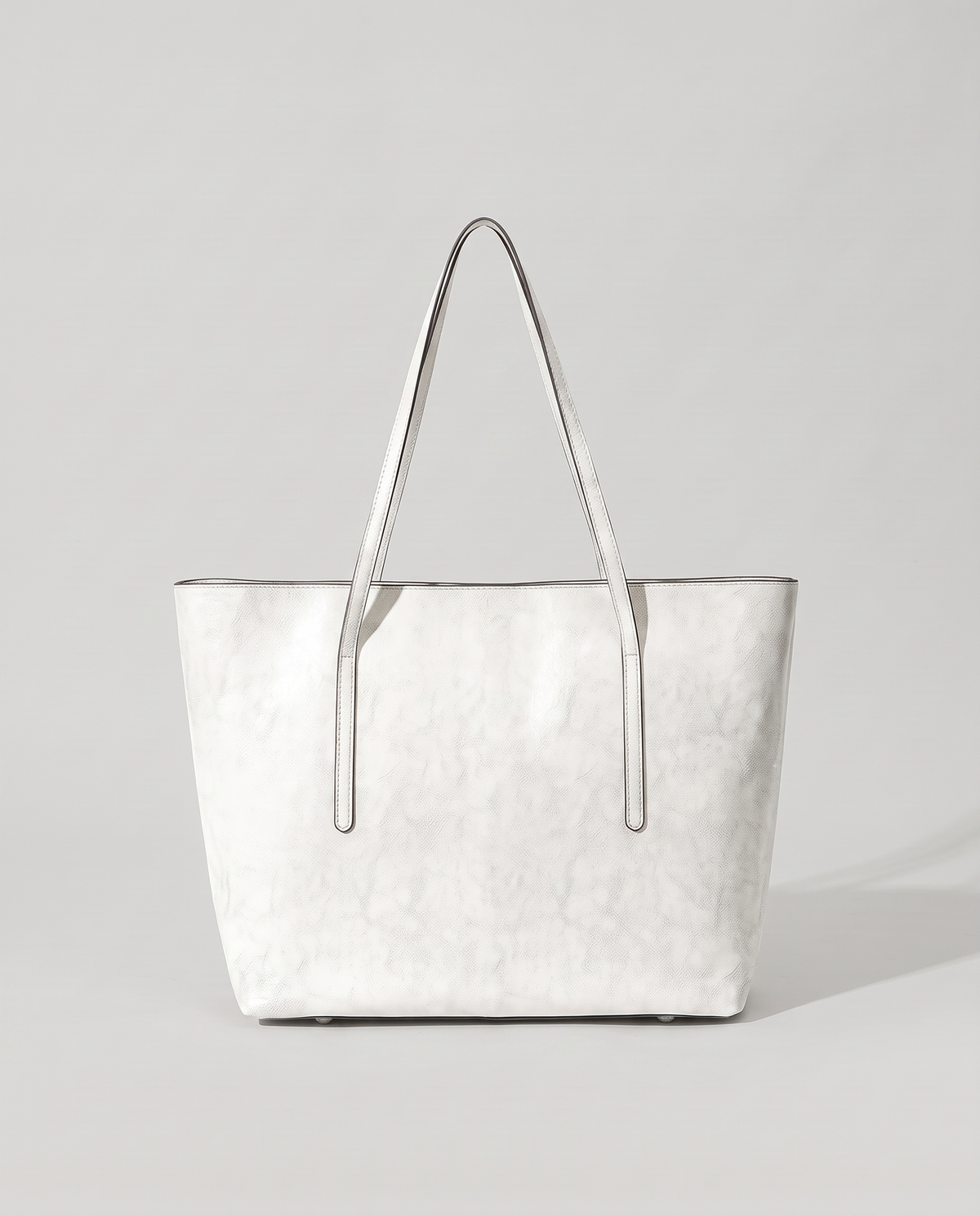 Molo oil-waxed leather tote in white, back view