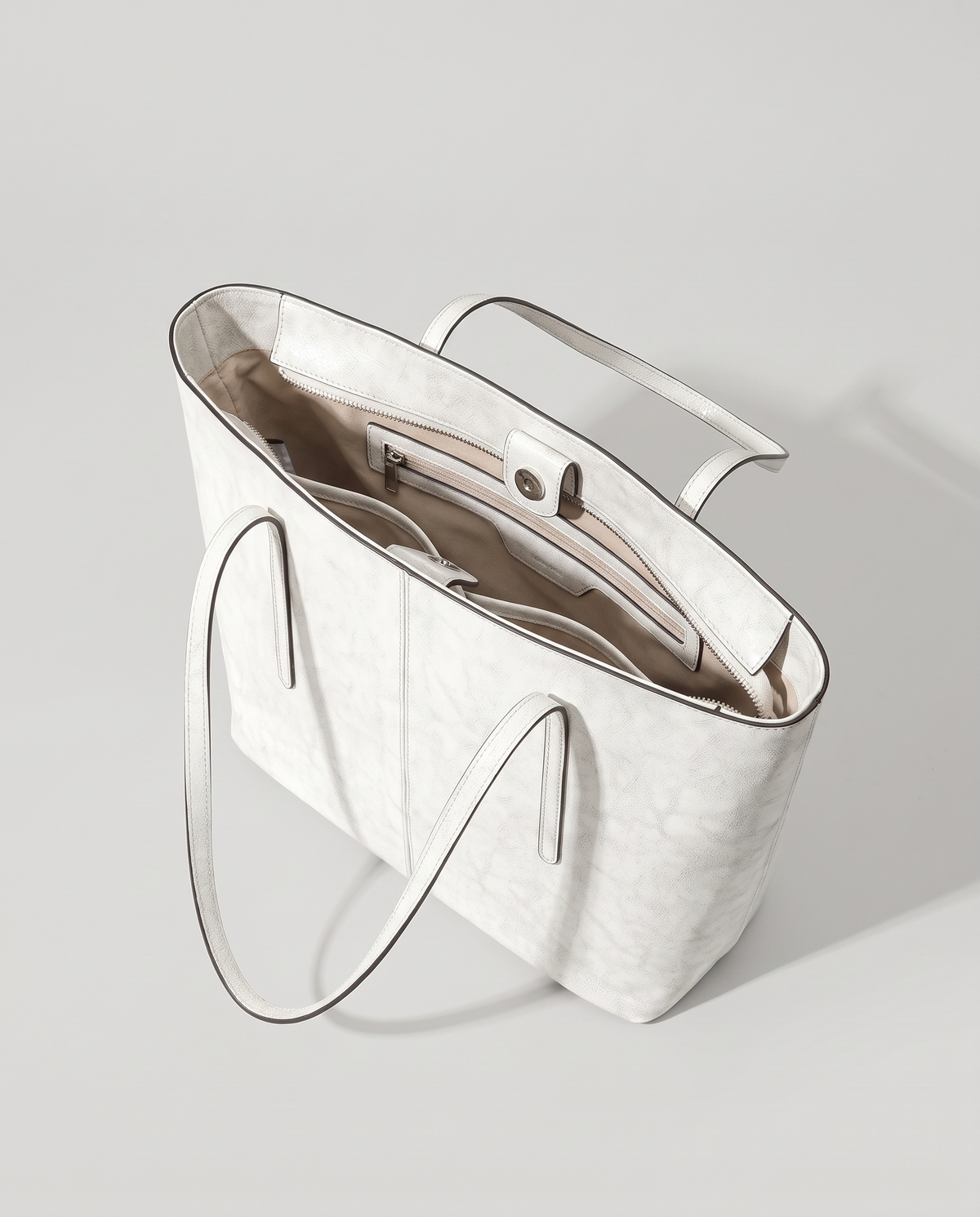 Molo oil-waxed leather tote in white, open showing interior