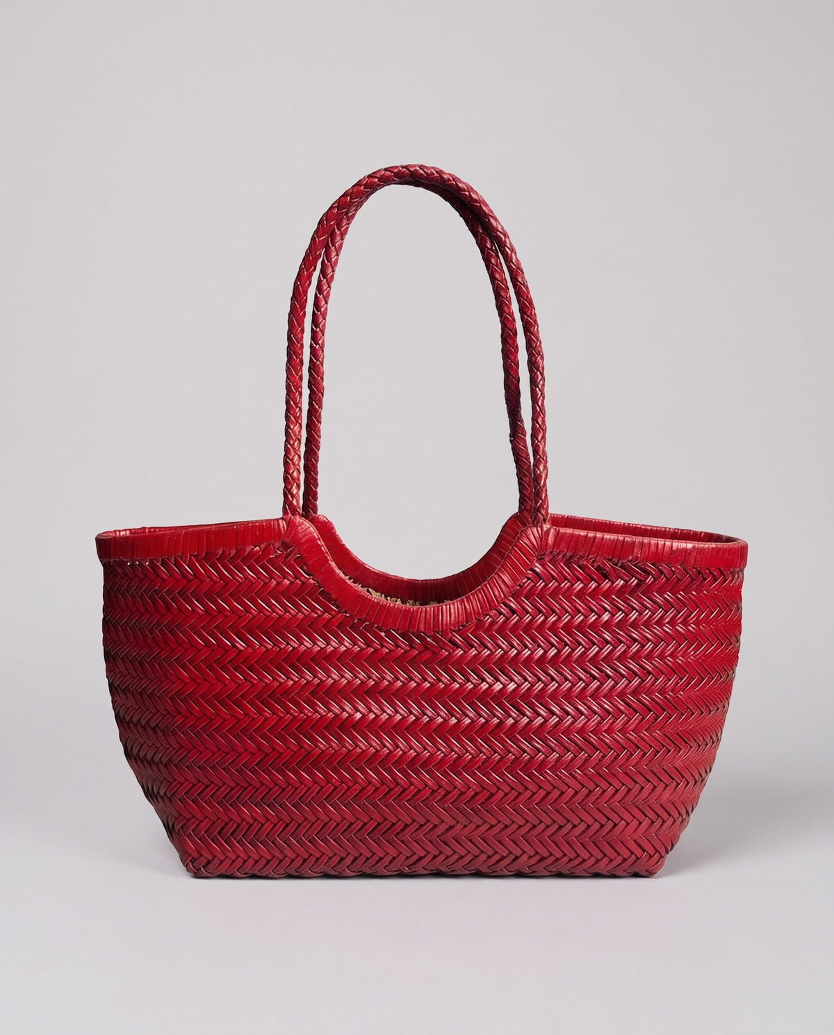 Hardware and handle detail on the Valentina Noto Small bag in Red