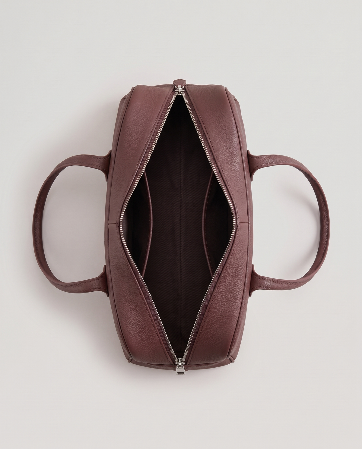 Ora Small leather shoulder bag in Chocolate – view from above with the zip open