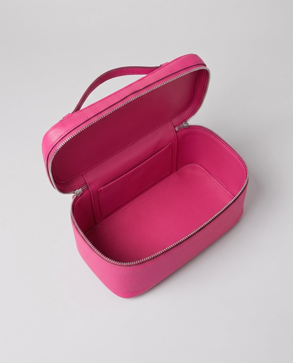 Inside view of the Orvieto vanity case in Fuchsia
