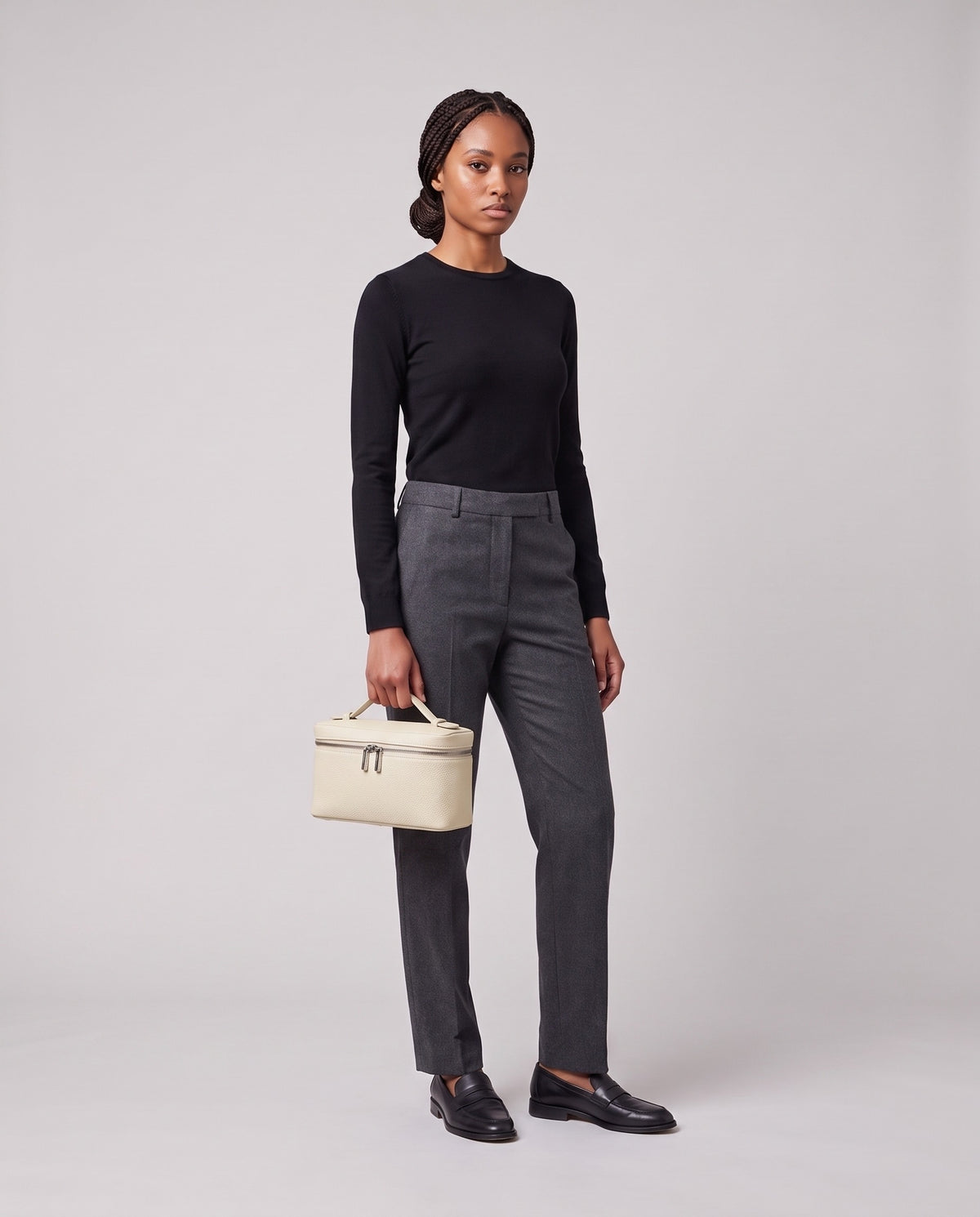 Model holding the VaValentina Orvieto Small top-handle bag in Ivory leather, three-quarter viewlentina Orvieto Small top-handle bag in Ivory leather, full length