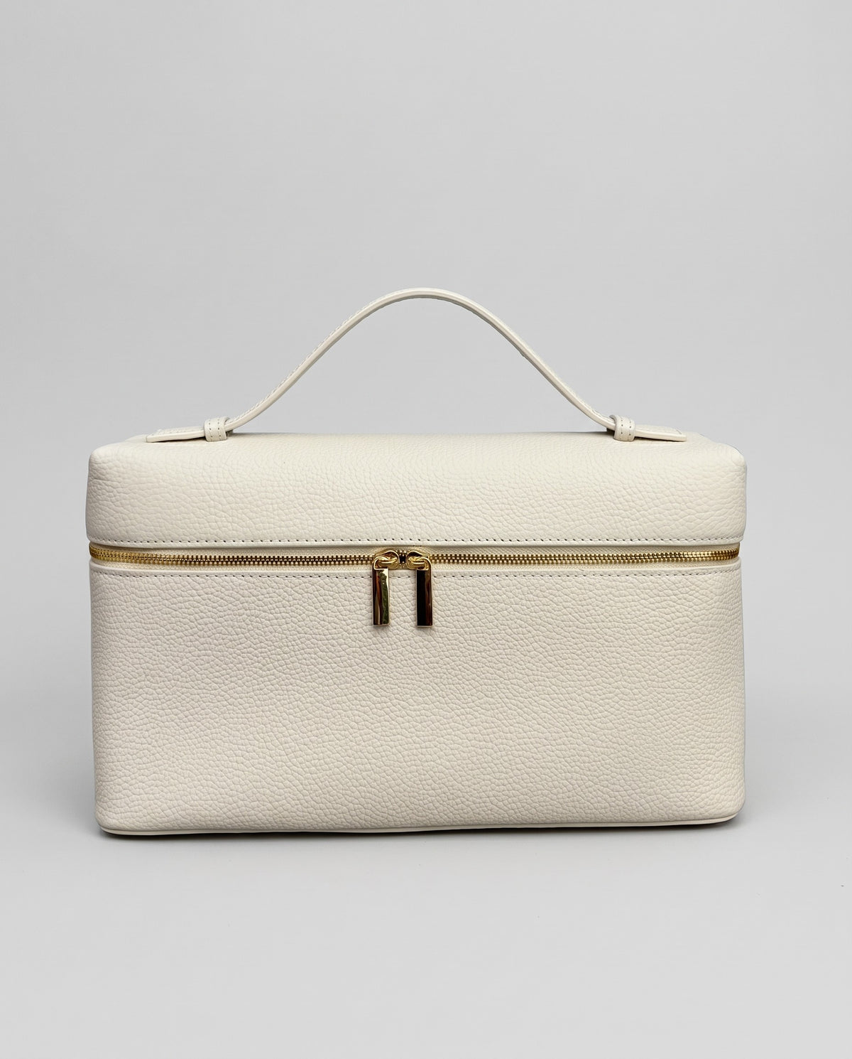 Orvieto pebbled leather vanity case in Ivory – front view