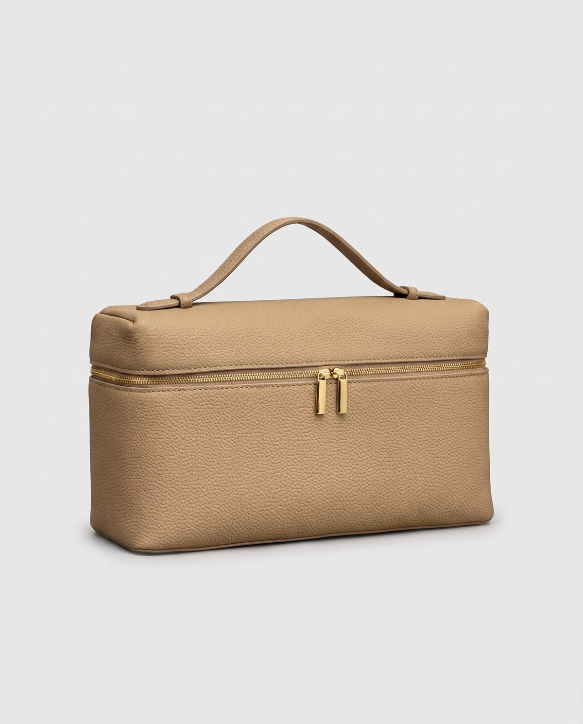 Orvieto pebbled leather vanity case in Stone – three-quarter view