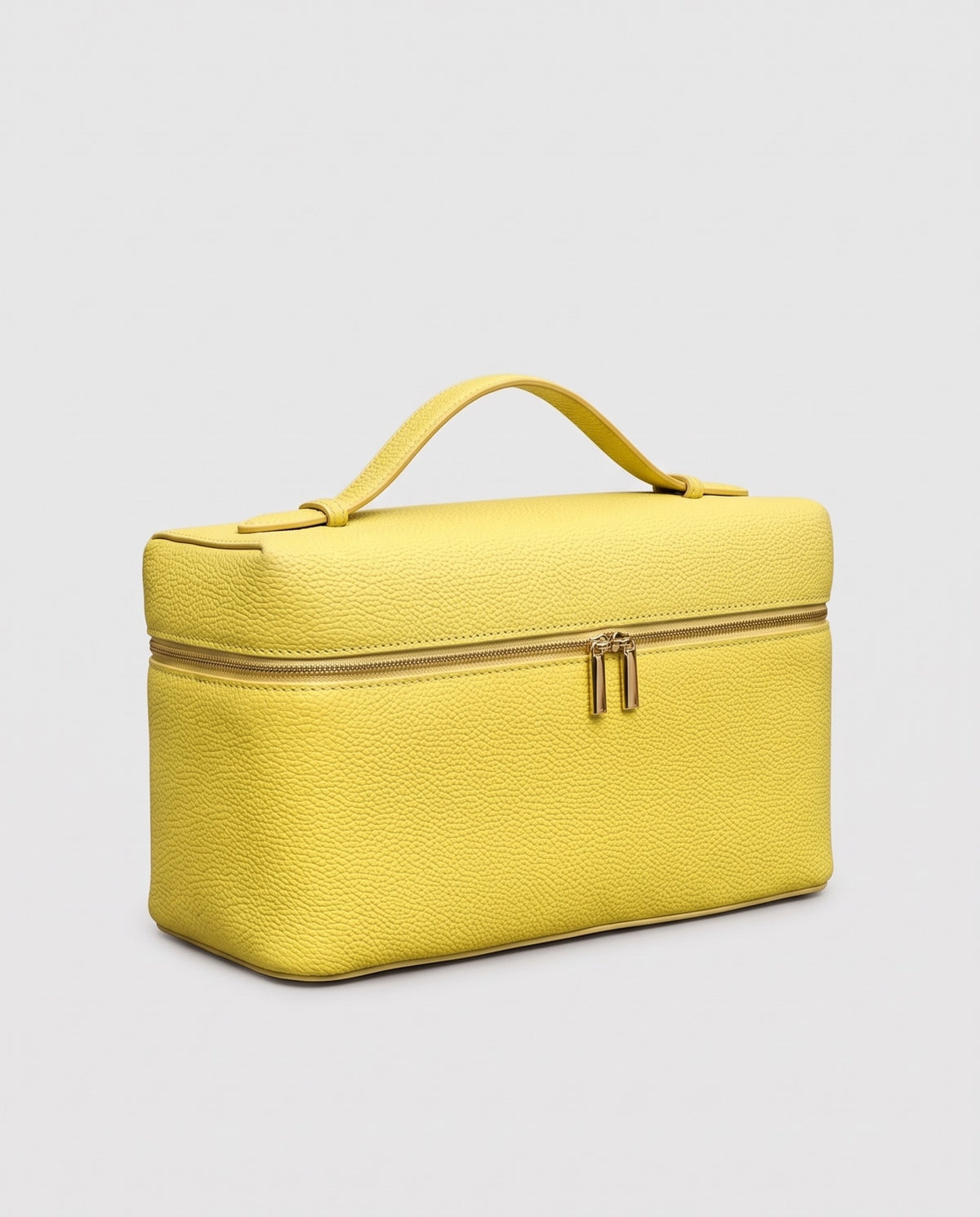 Orvieto pebbled leather vanity case in Yellow – three-quarter view