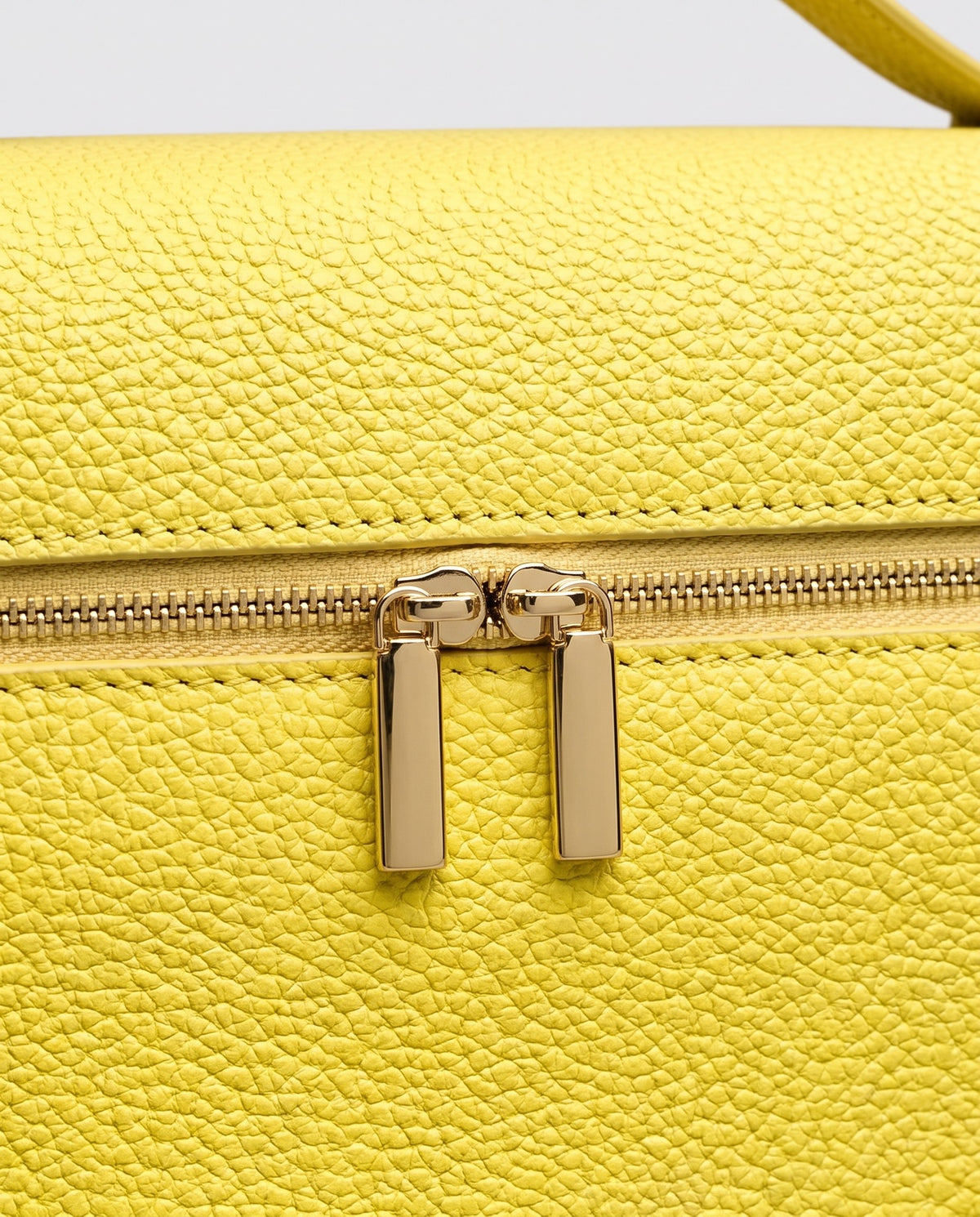 Gold zip detail on the Orvieto vanity case in Yellow