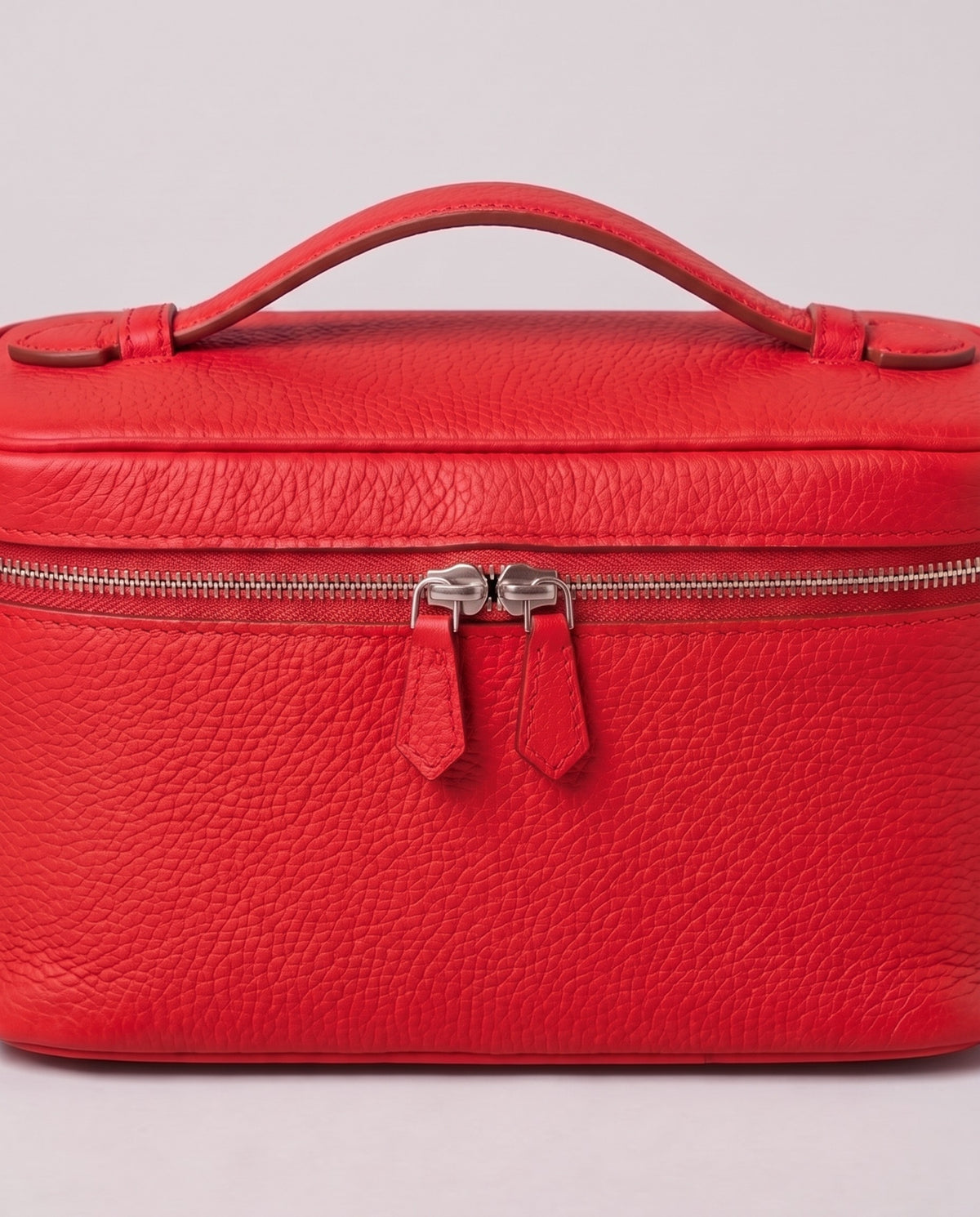 Silver zip and handle detail on the Valentina Orvieto Small bag in Red leather