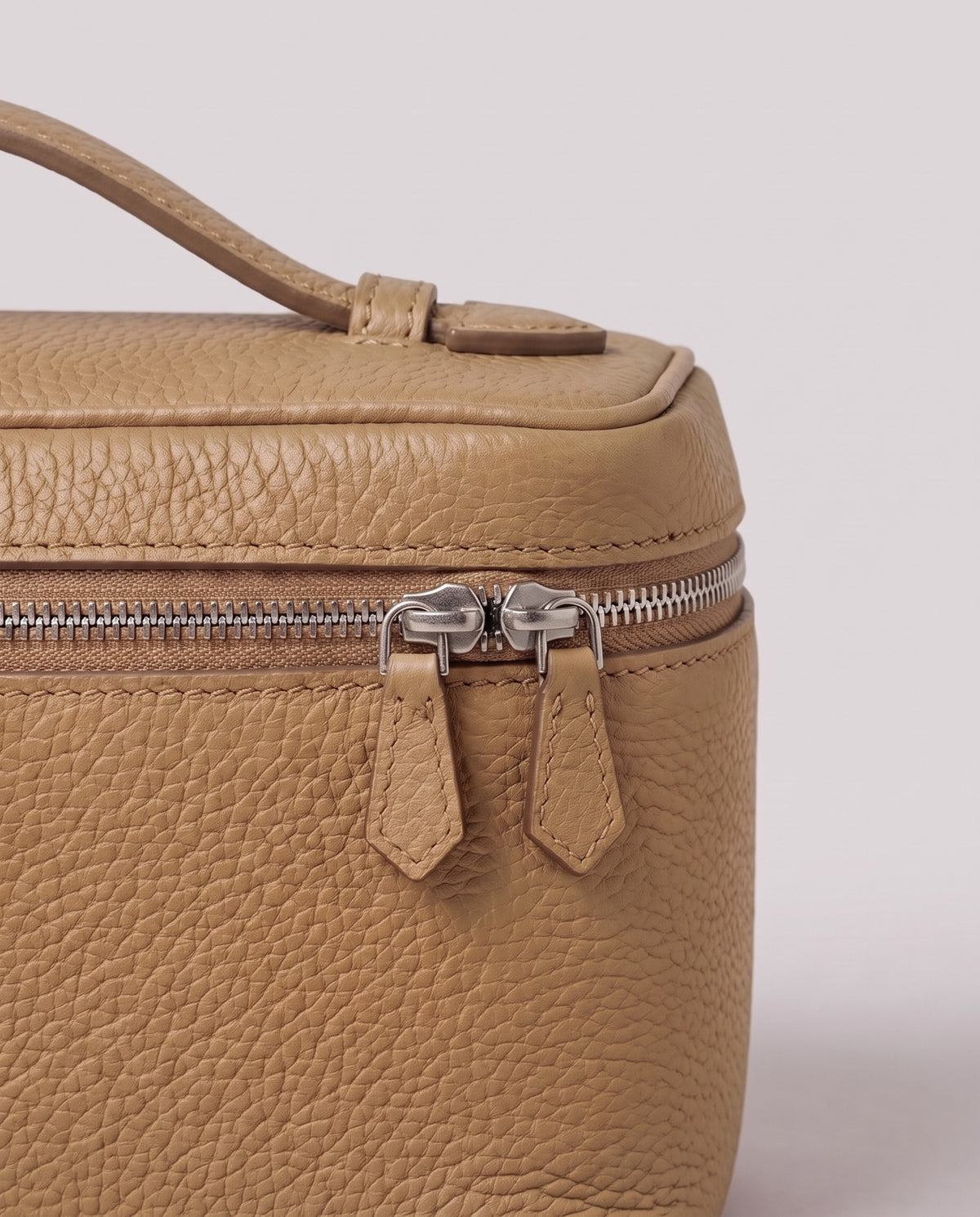 Pebbled leather close-up of the Valentina Orvieto Small bag in Stone