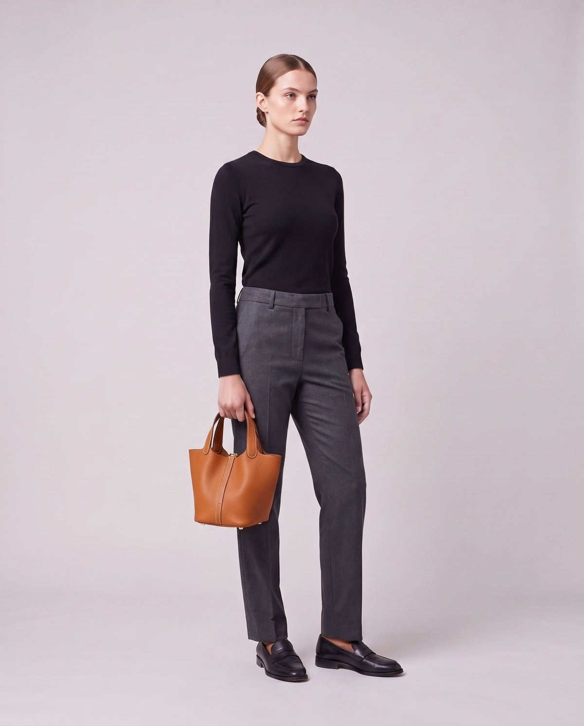 Model holding the Valentina Ostuni Large bag in Caramel, full length