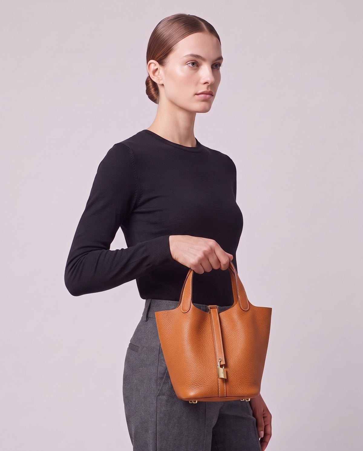 Model carrying the Valentina Ostuni Large bag in Caramel