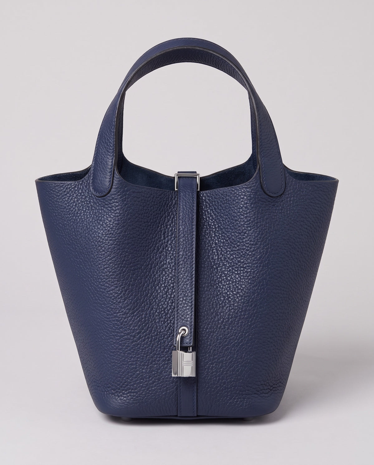 Hardware and handle detail on the Valentina Ostuni Large bag in Navy