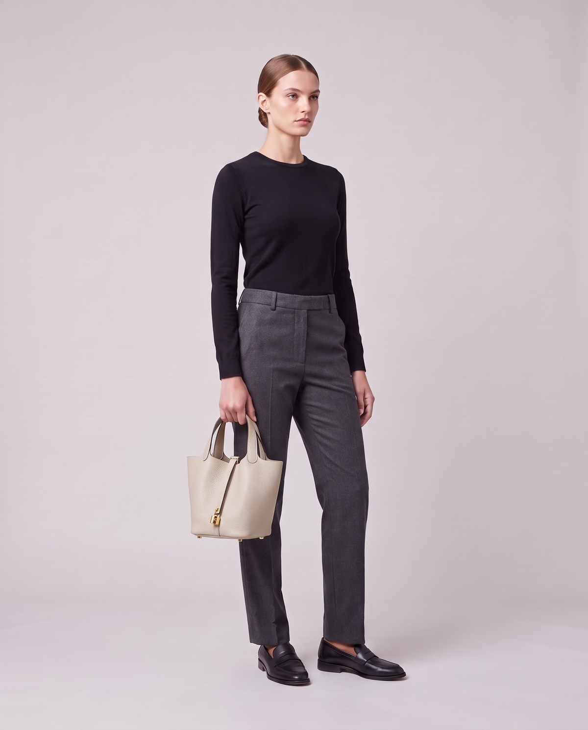 Model holding the Valentina Ostuni Large bag in Pearl, full length