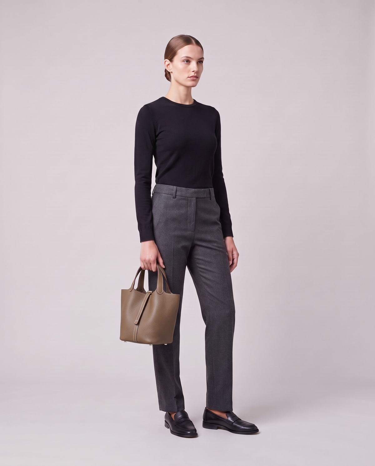 Model holding the Valentina Ostuni Large bag in Taupe, full length