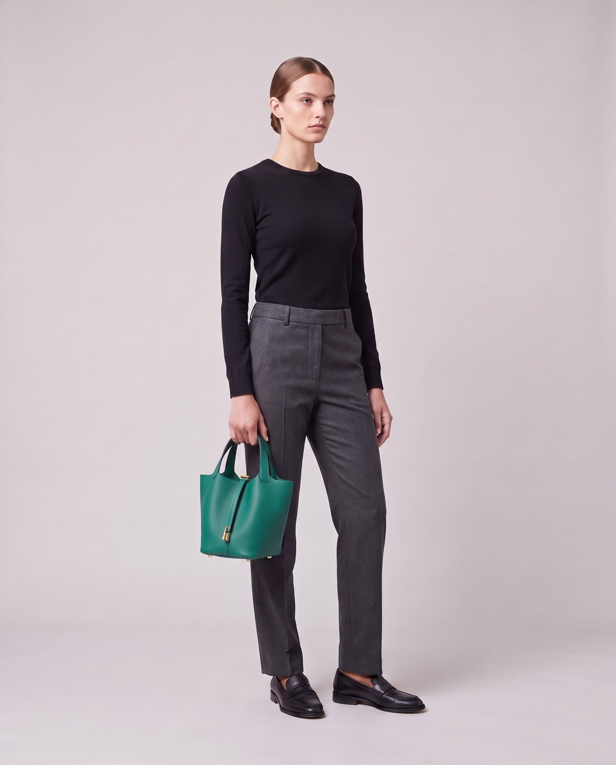 Model holding the Valentina Ostuni Large bag in Teal, full length