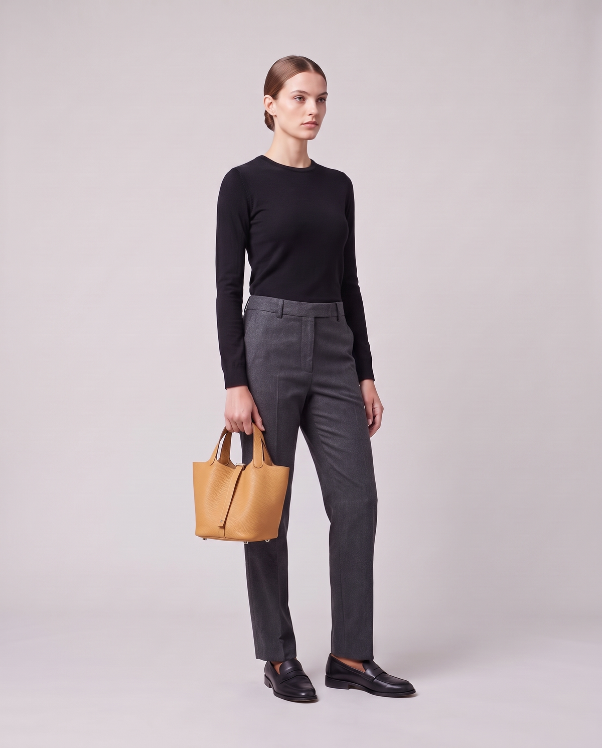 Model holding the Valentina Ostuni Small bag in Apricot, full length
