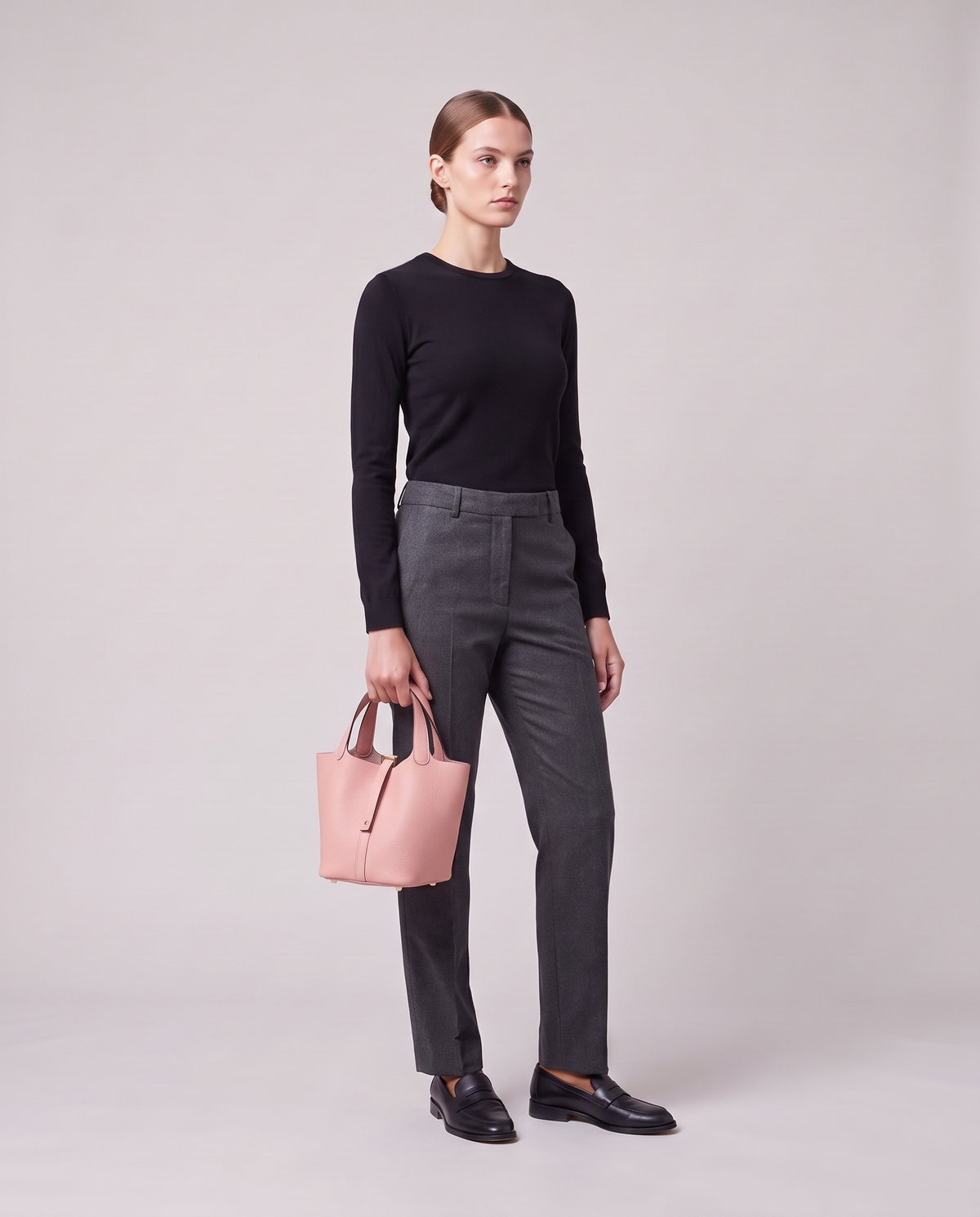 Model holding the Valentina Ostuni Small bag in Blush, full length