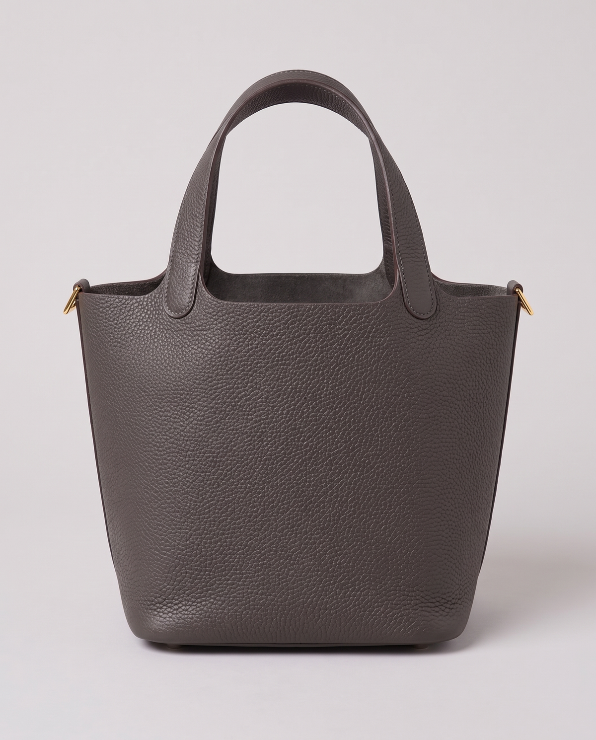 Hardware and handle detail on the Valentina Ostuni Small bag in Charcoal