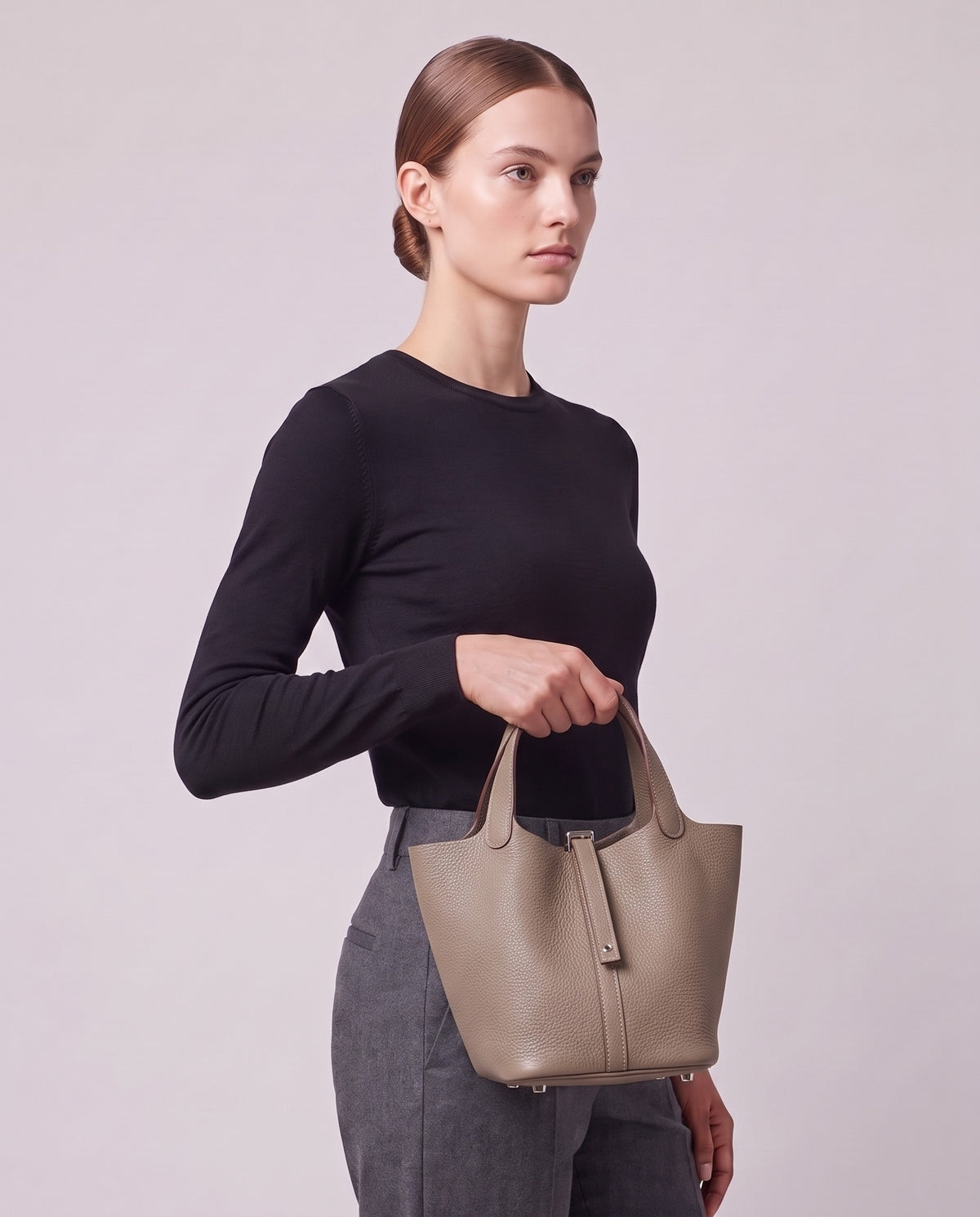 Model carrying the Valentina Ostuni Small bag in Stone