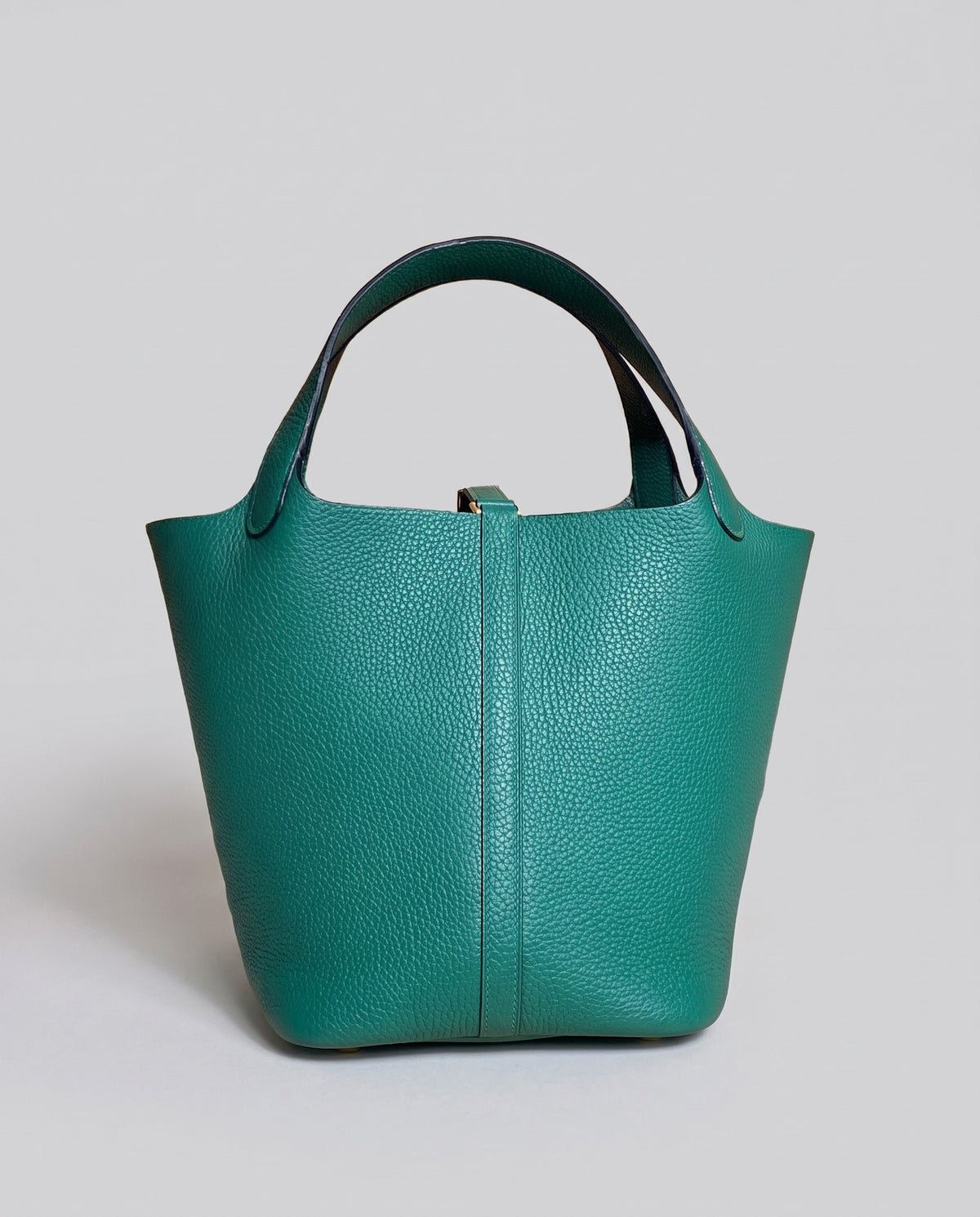 Hardware and handle detail on the Valentina Ostuni Small bag in Teal