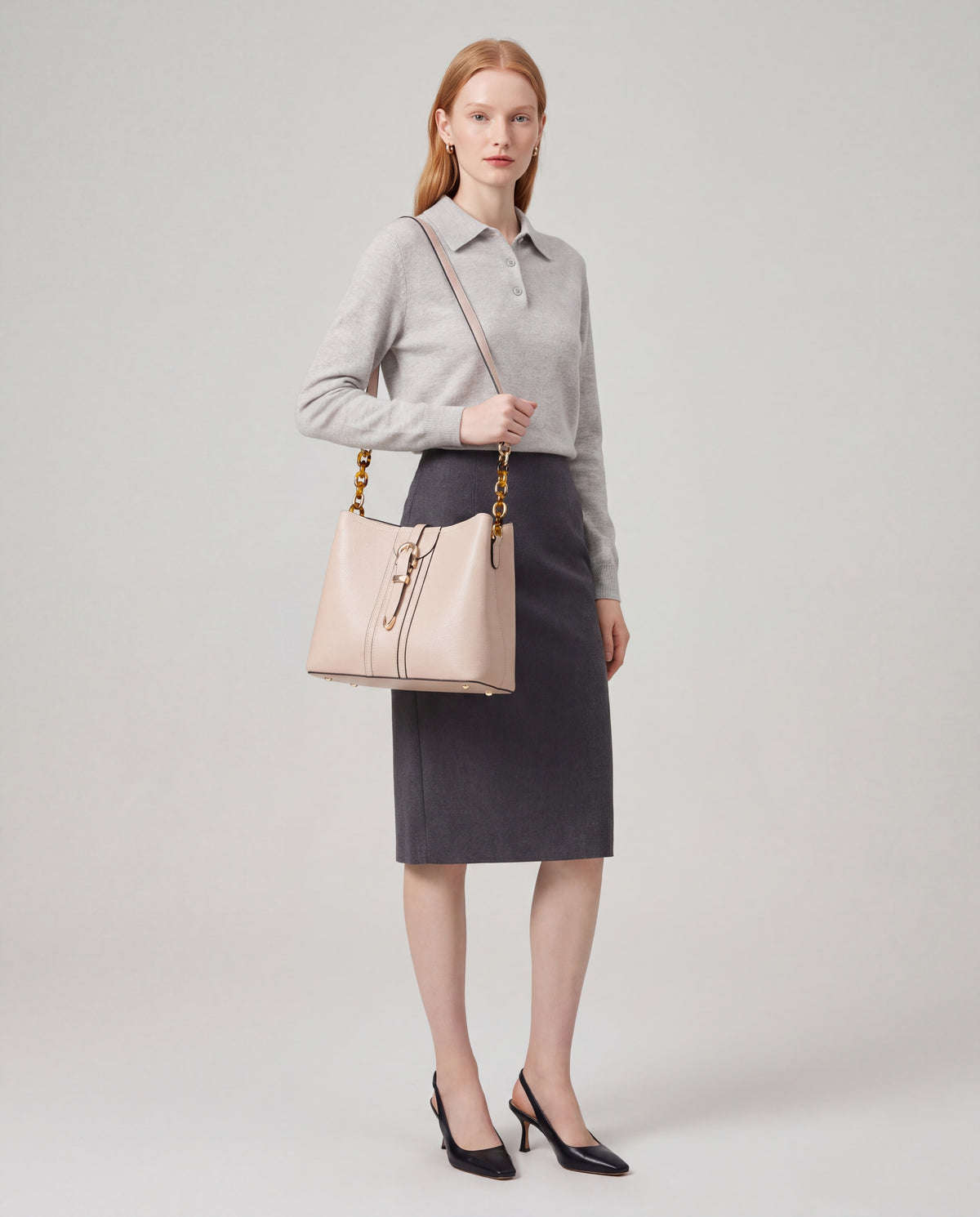 Outline bag in Beige – worn by model, full length
