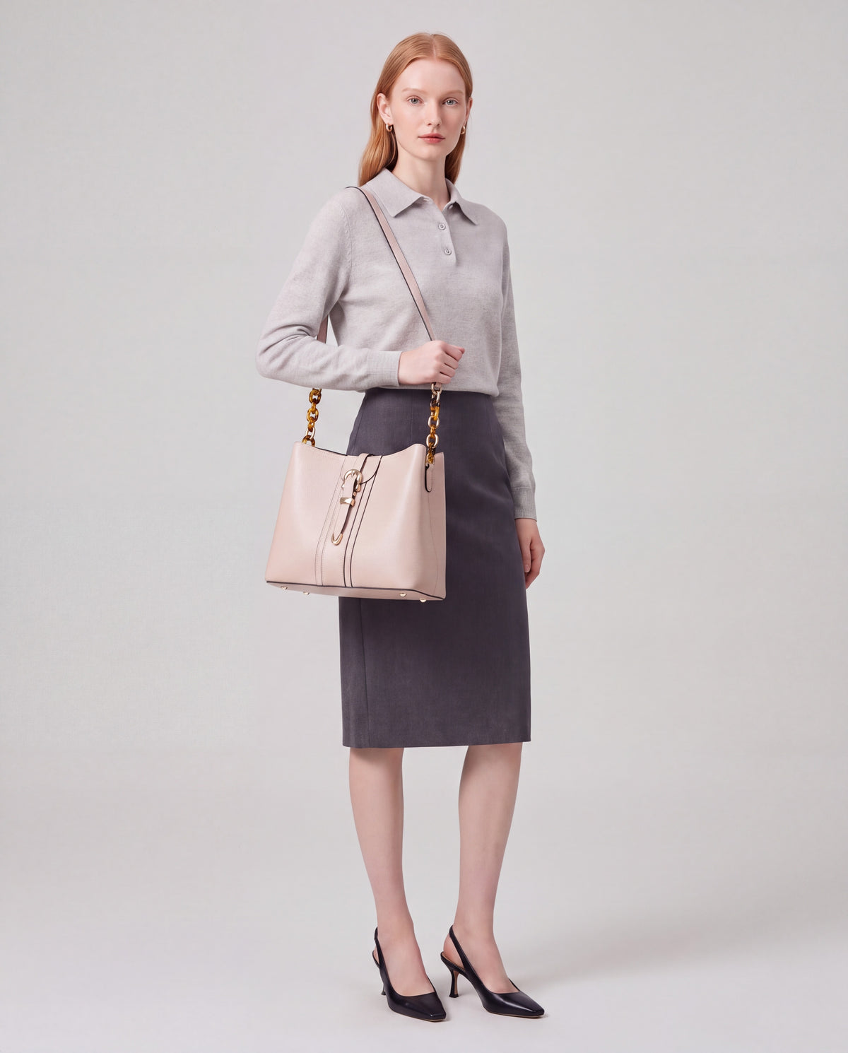 Outline bag in Beige – carried by model, close-up