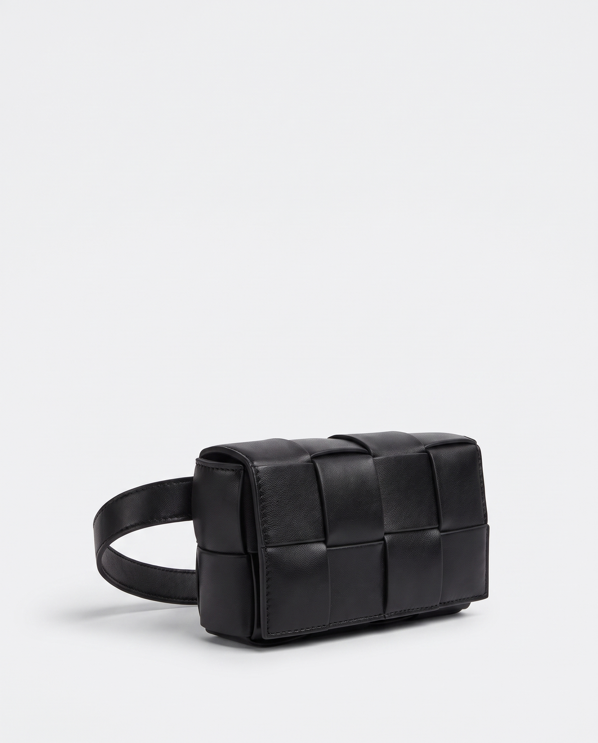 Cassette padded woven leather belt bag in Black – three-quarter view