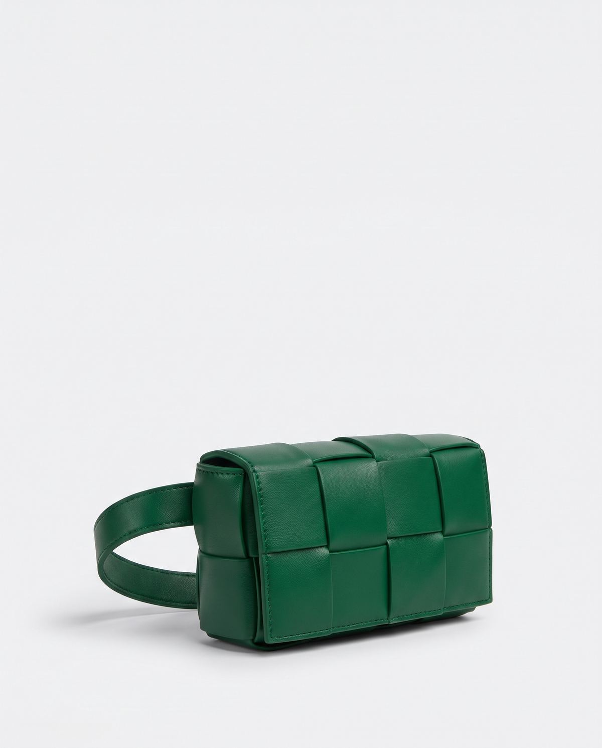 Cassette padded woven leather belt bag in Green – three-quarter view