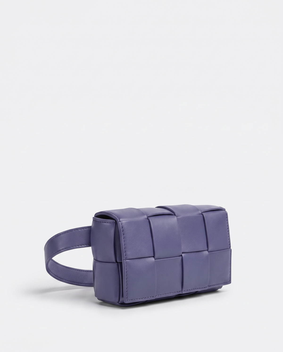 Cassette padded woven leather belt bag in Purple – three-quarter view