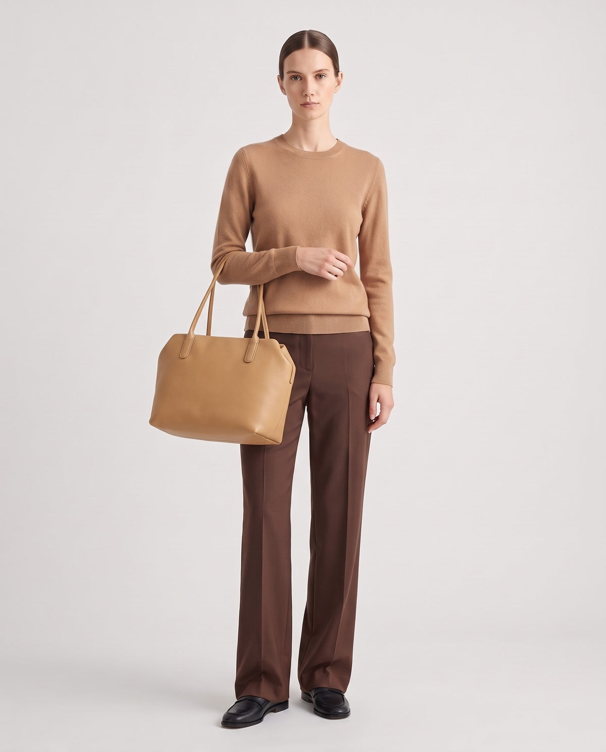 Pavia leather tote in Camel – model holding it, full length