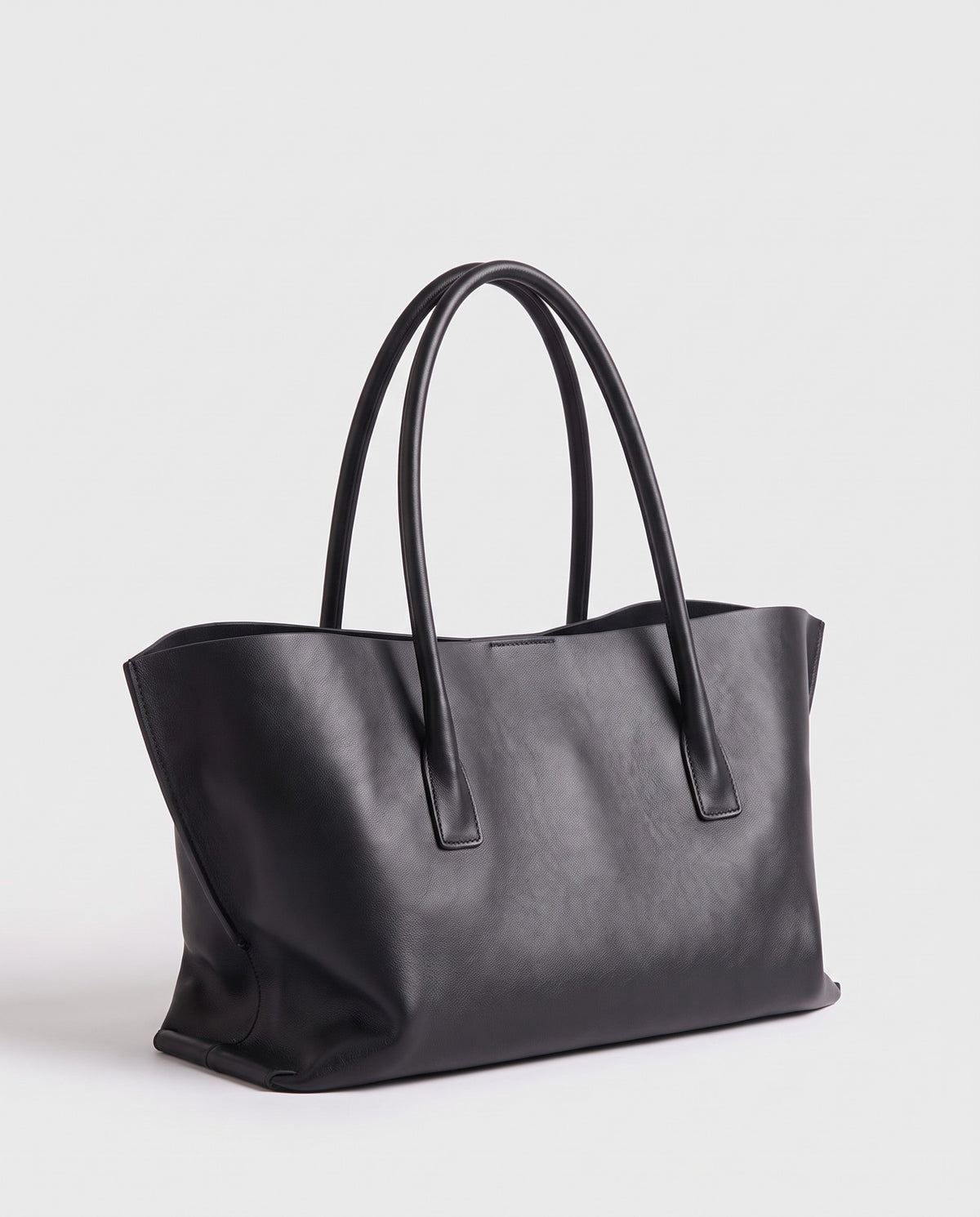 Piano leather tote in Black – three-quarter view