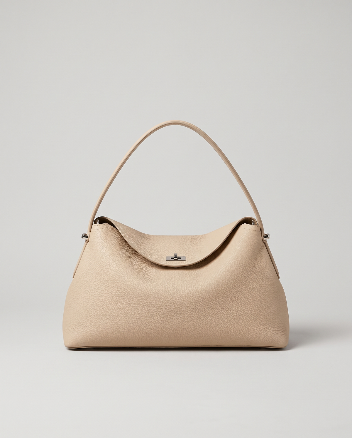 Porto pebbled leather top-handle bag in beige, front view