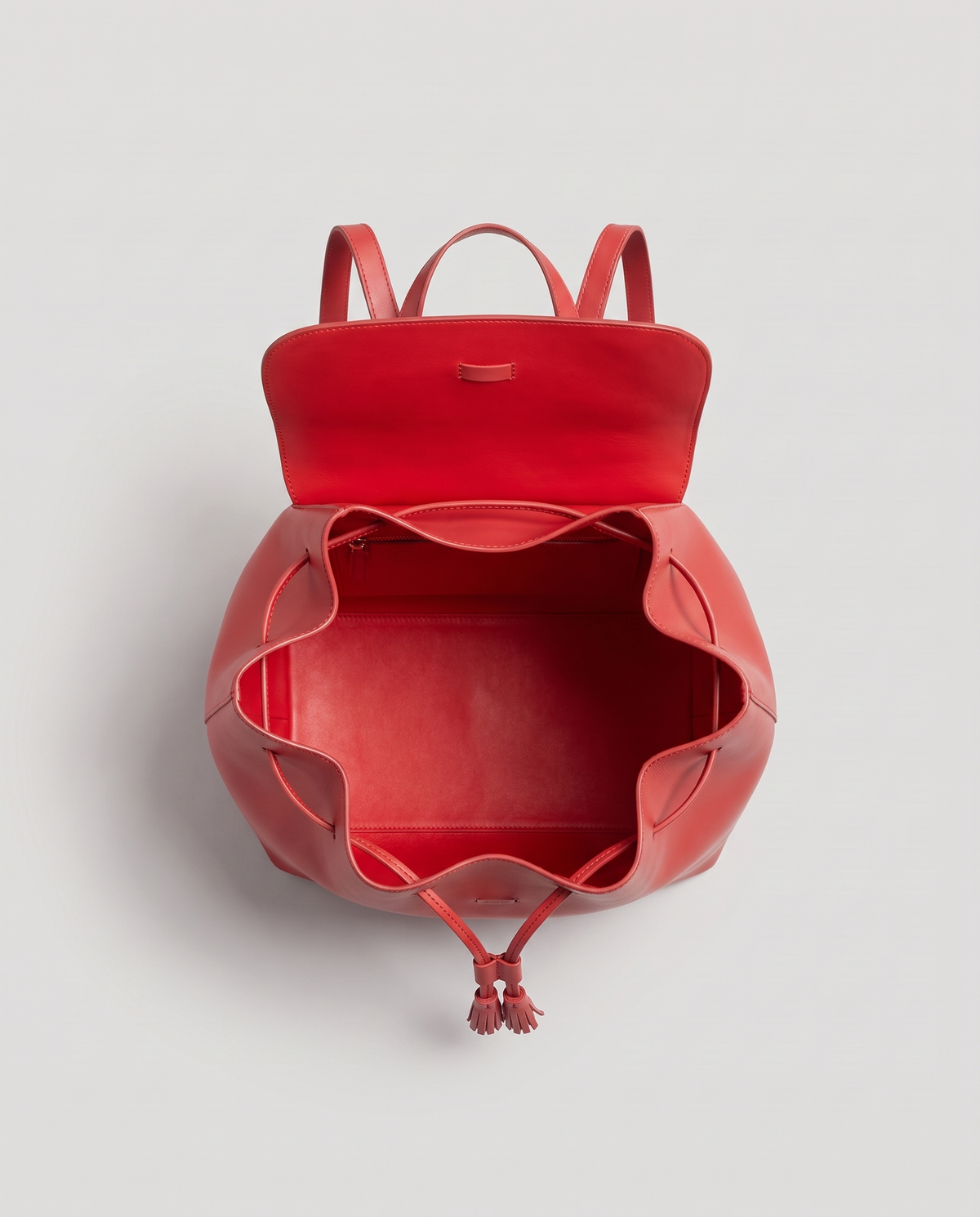 Roam Large leather backpack in Red – flap open, showing the red leather lining