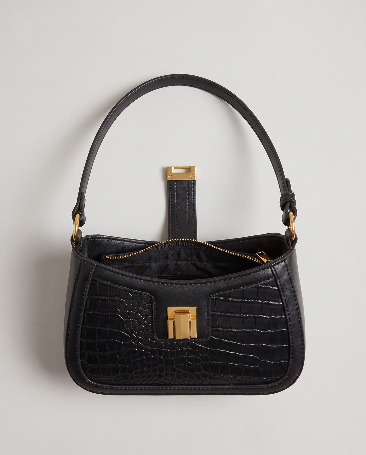 Sable croc-embossed shoulder bag in Black – open, showing the zip and lined interior