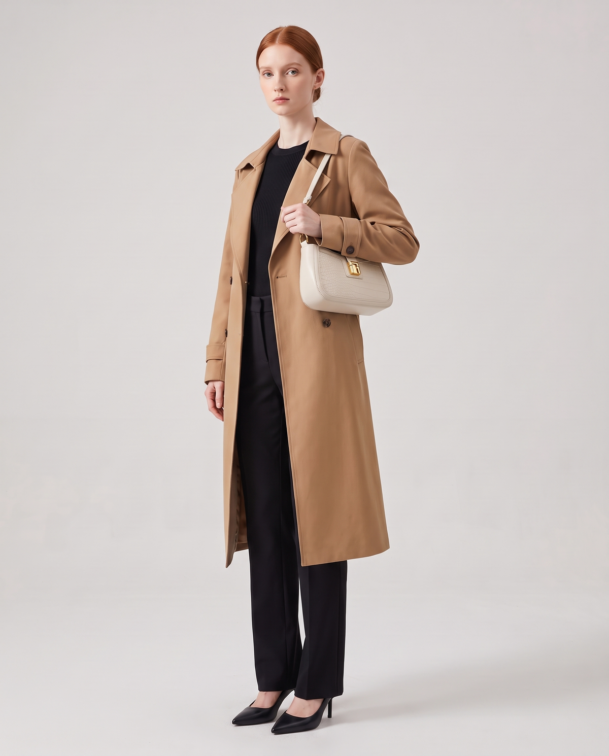 Sable croc-embossed shoulder bag in Chalk – model wearing it on her shoulder, full length