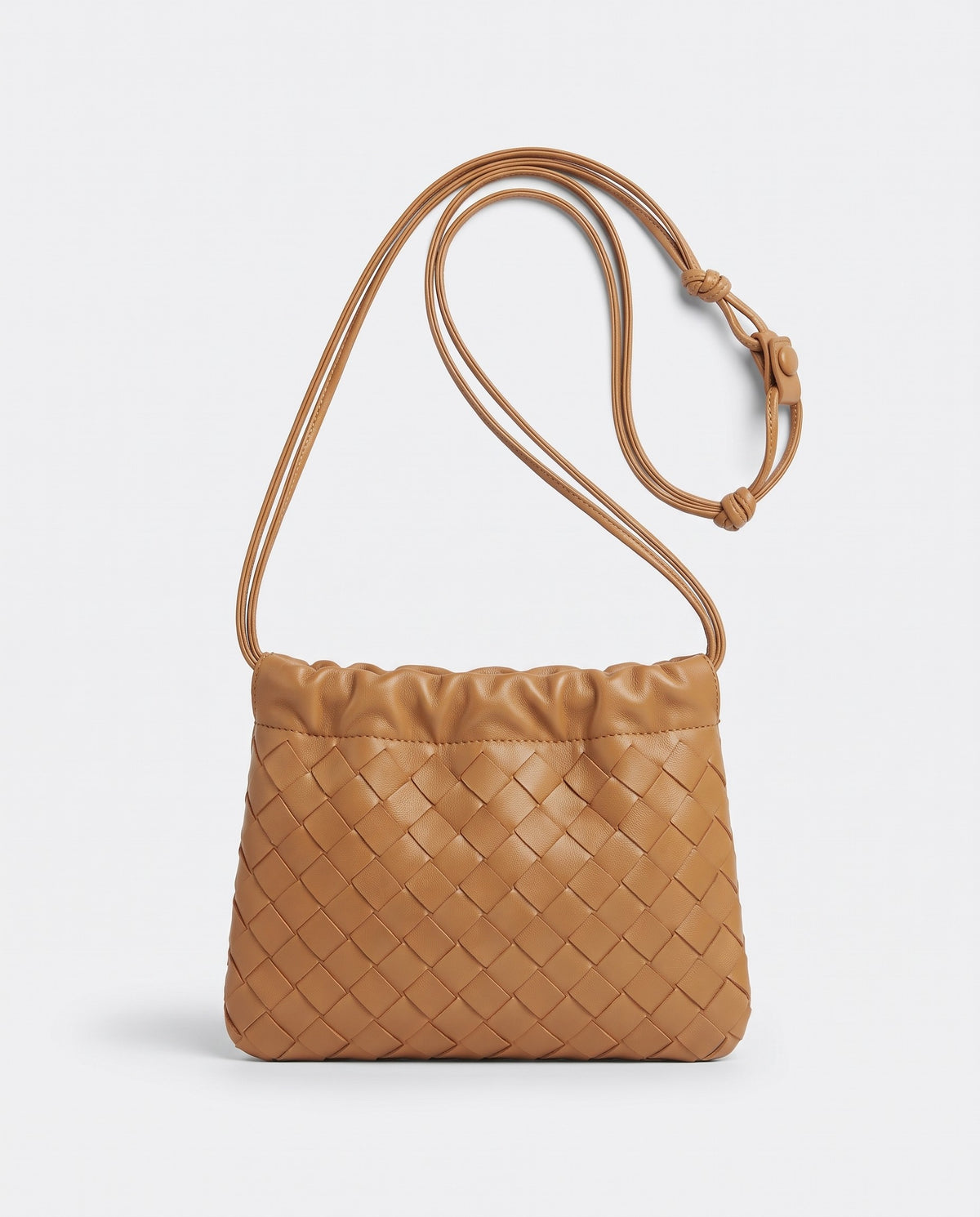 Serata woven leather clutch in Camel – front view
