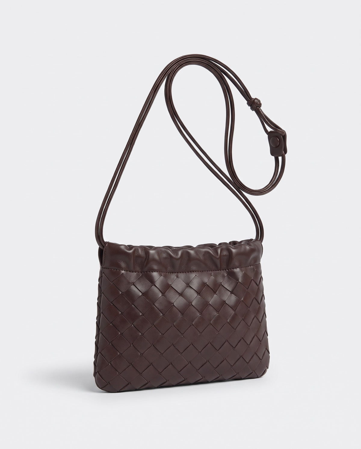 Serata woven leather clutch in Espresso – three-quarter view