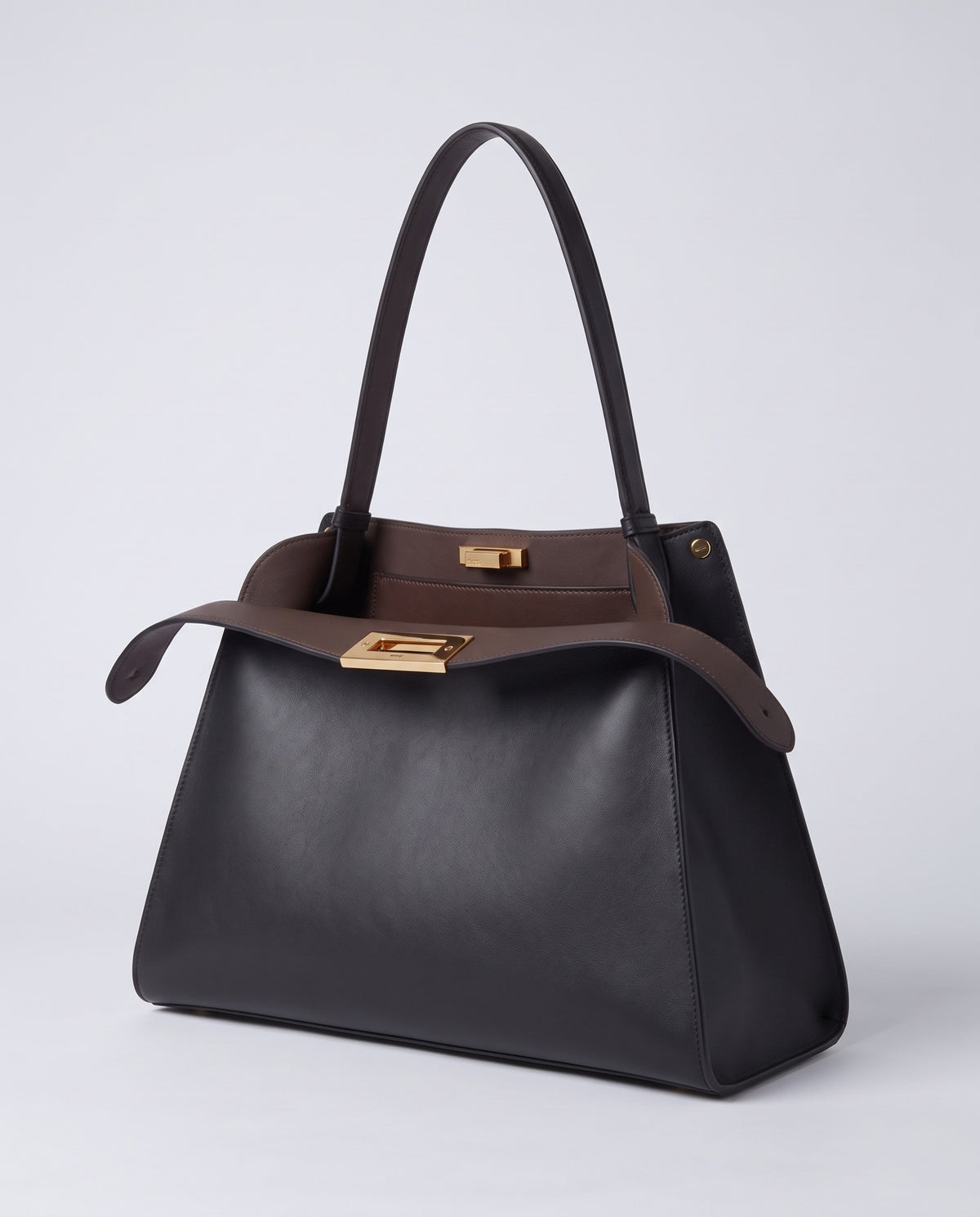 Siracusa structured leather top-handle bag in Black – three-quarter view