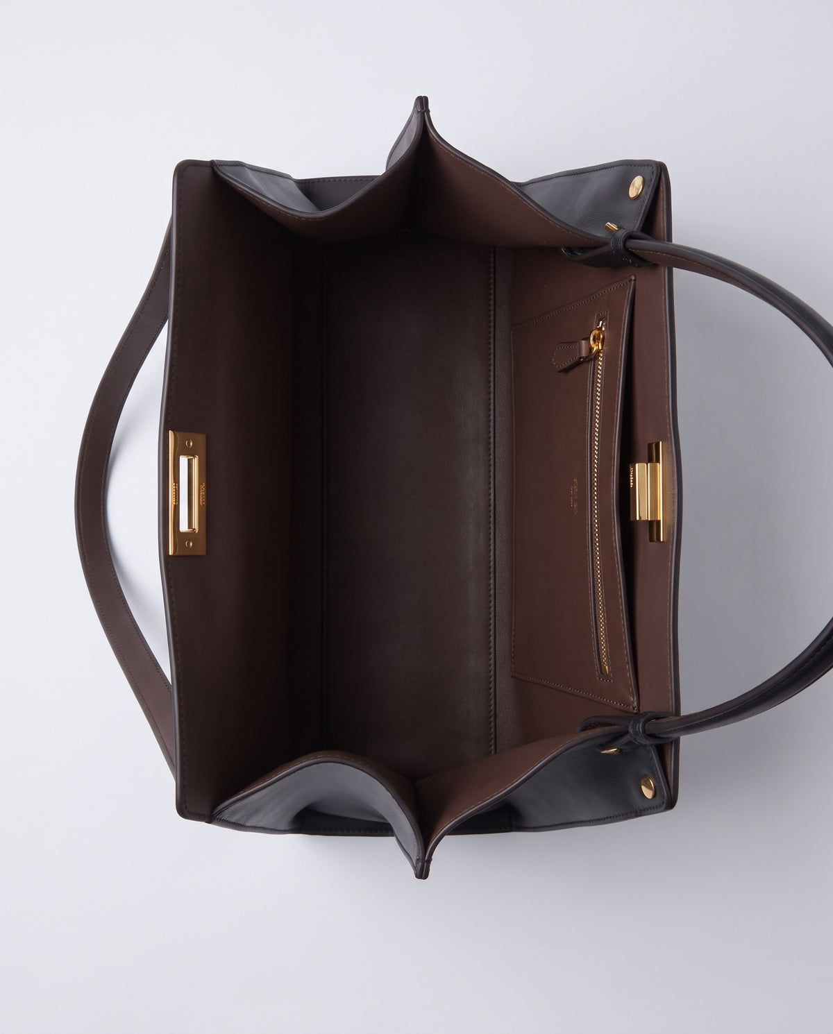 Siracusa leather bag in Black – inside view with brown lining and pockets