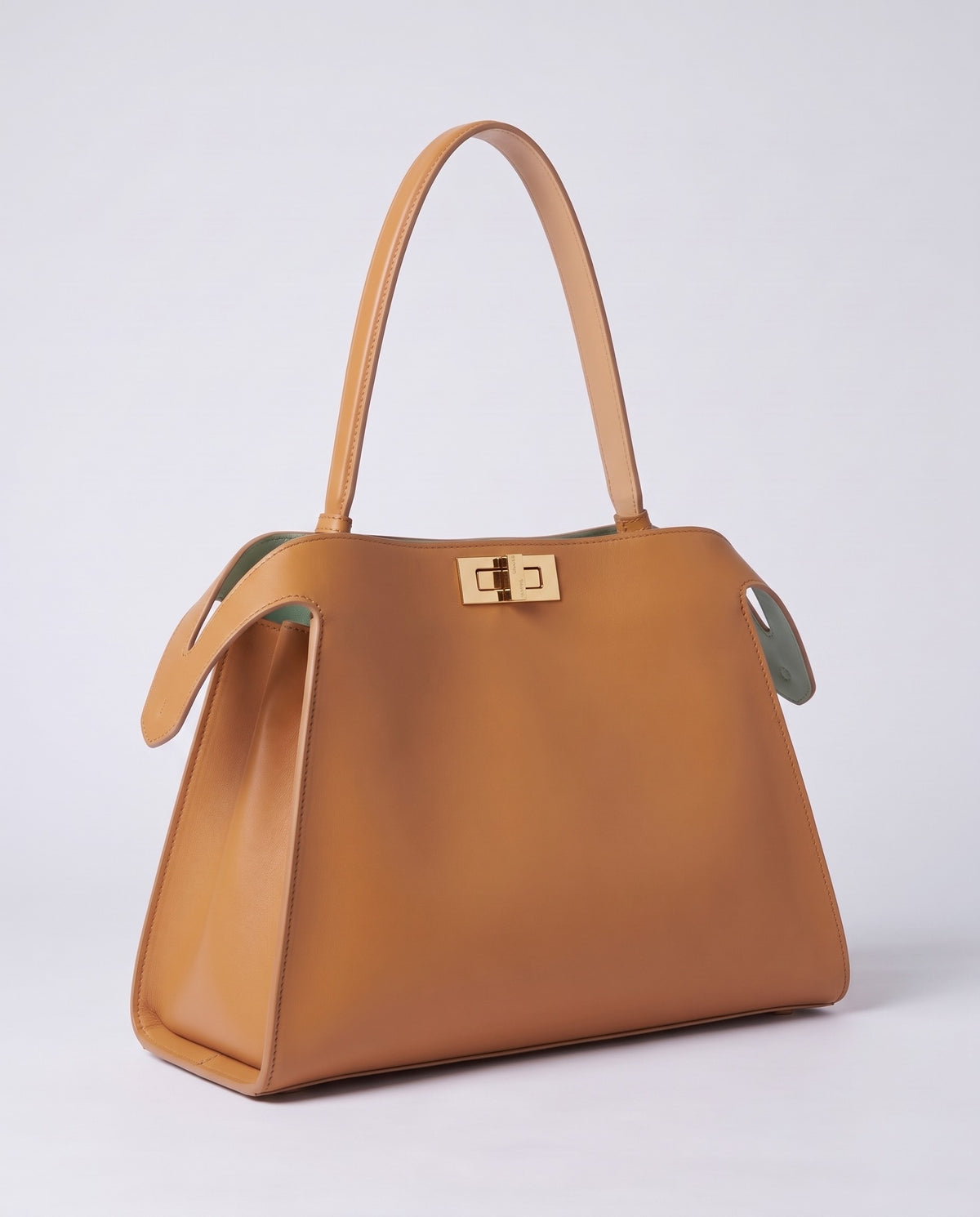 Siracusa structured leather top-handle bag in Tan – three-quarter view