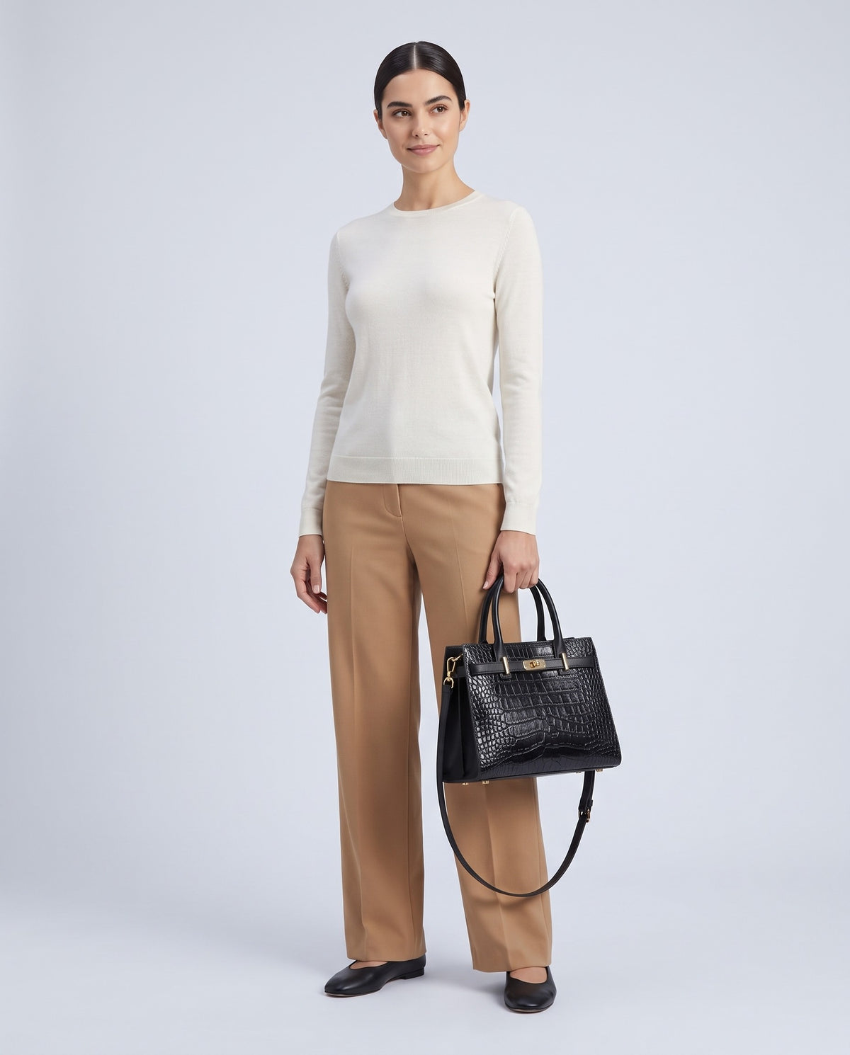 Model wearing the Sorrento croc-embossed top-handle bag in Black – full-length view