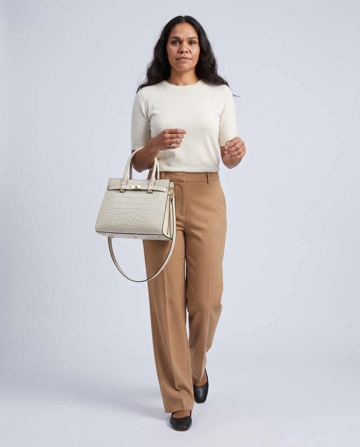 Model wearing the Sorrento croc-embossed top-handle bag in White – full-length view