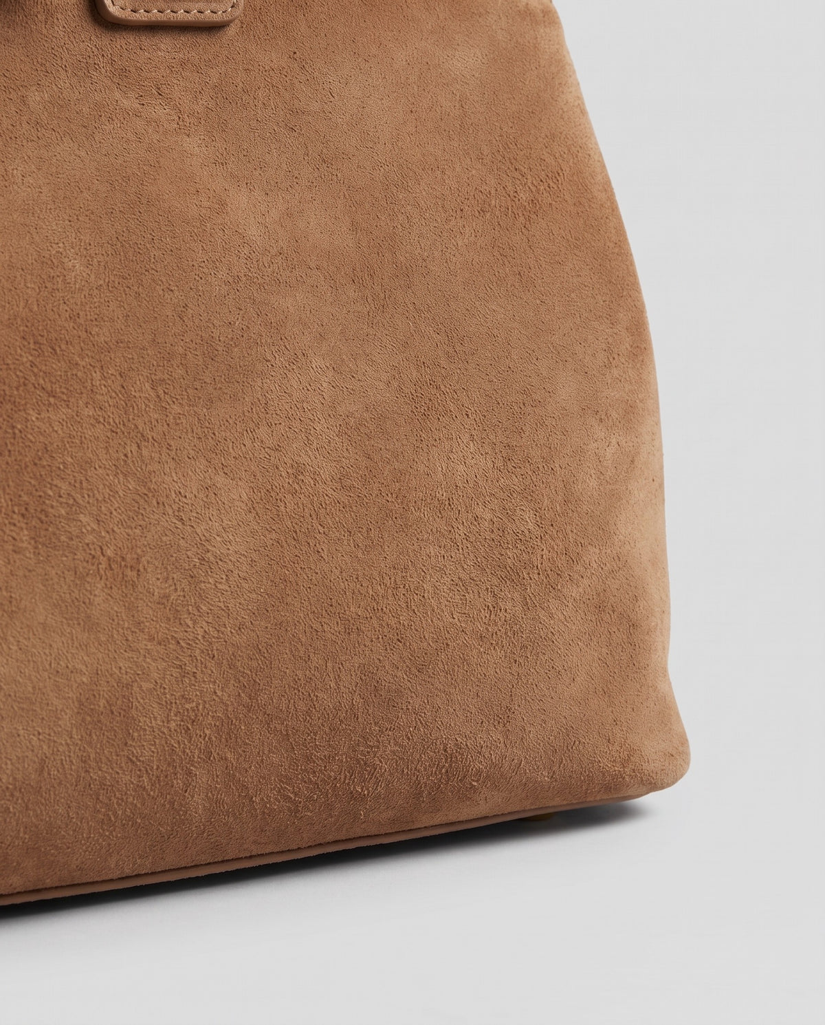 Close-up of the brushed suede on the Spello bag in Camel