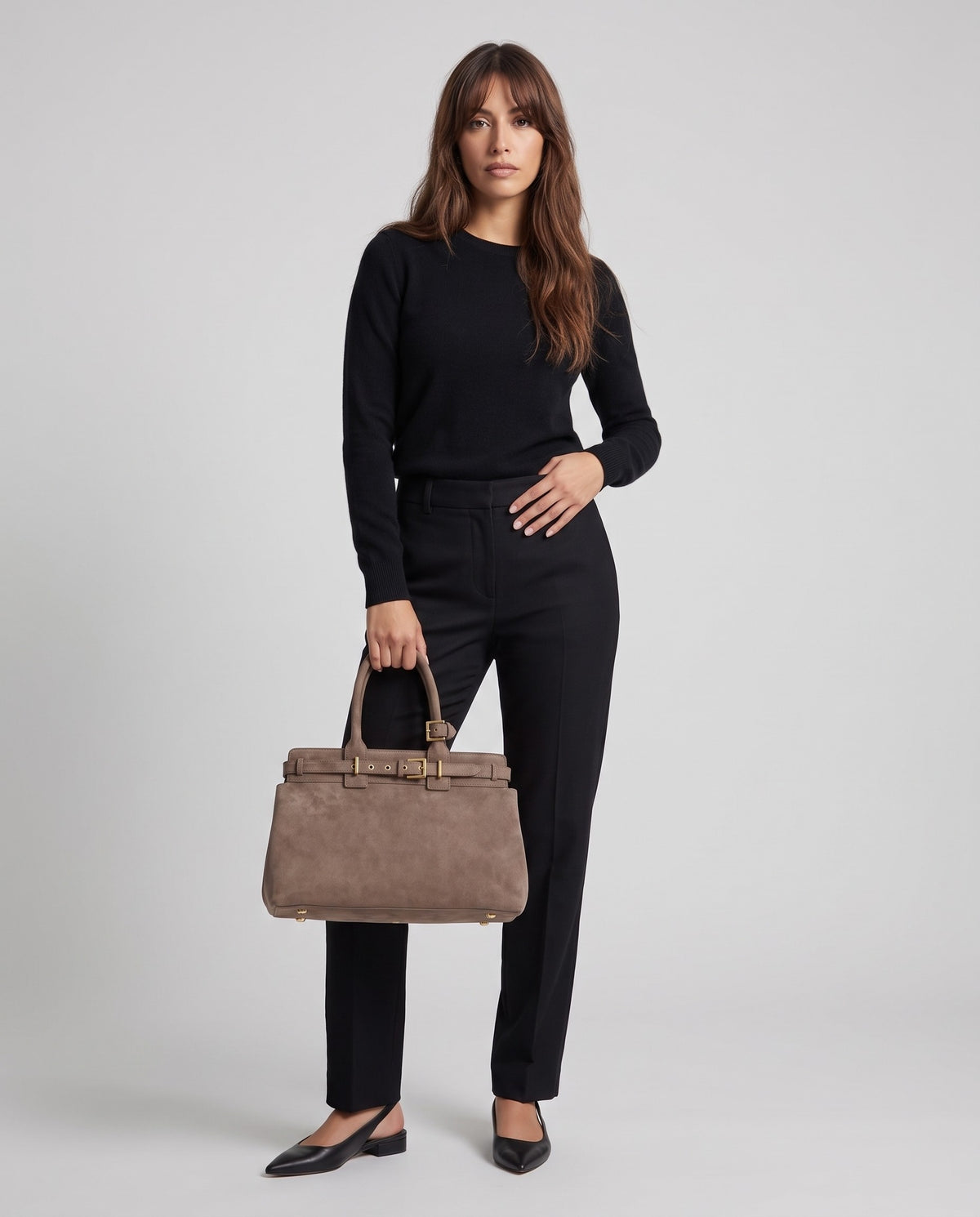 Model wearing the Spello top-handle bag in Taupe – full-length view