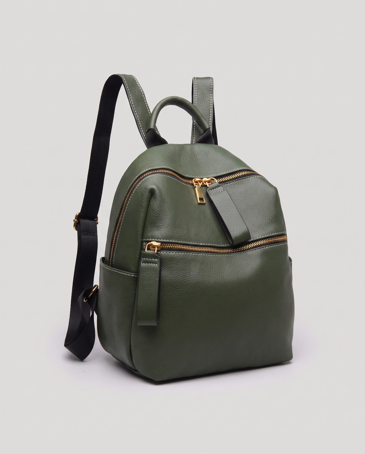 Tab pebbled leather backpack in Forest – three-quarter view