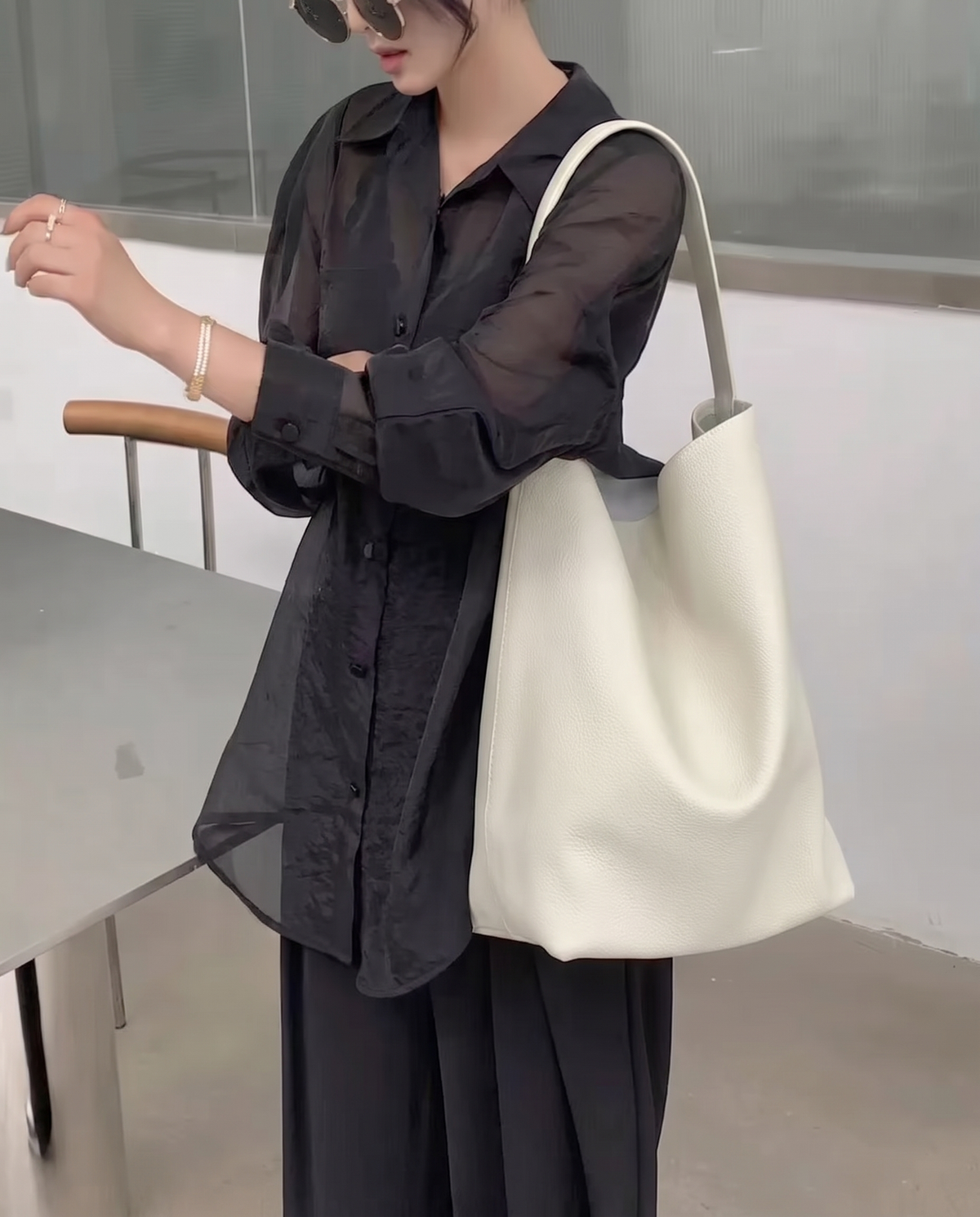Hardware and handle detail on the Valentina Tela Large bag in Cream