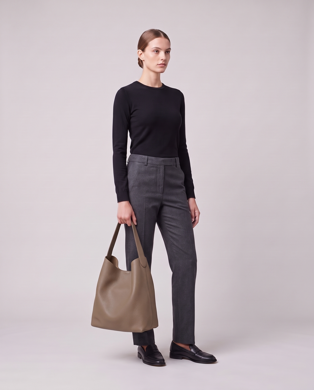 Model holding the Valentina Tela Large bag in Taupe, full length