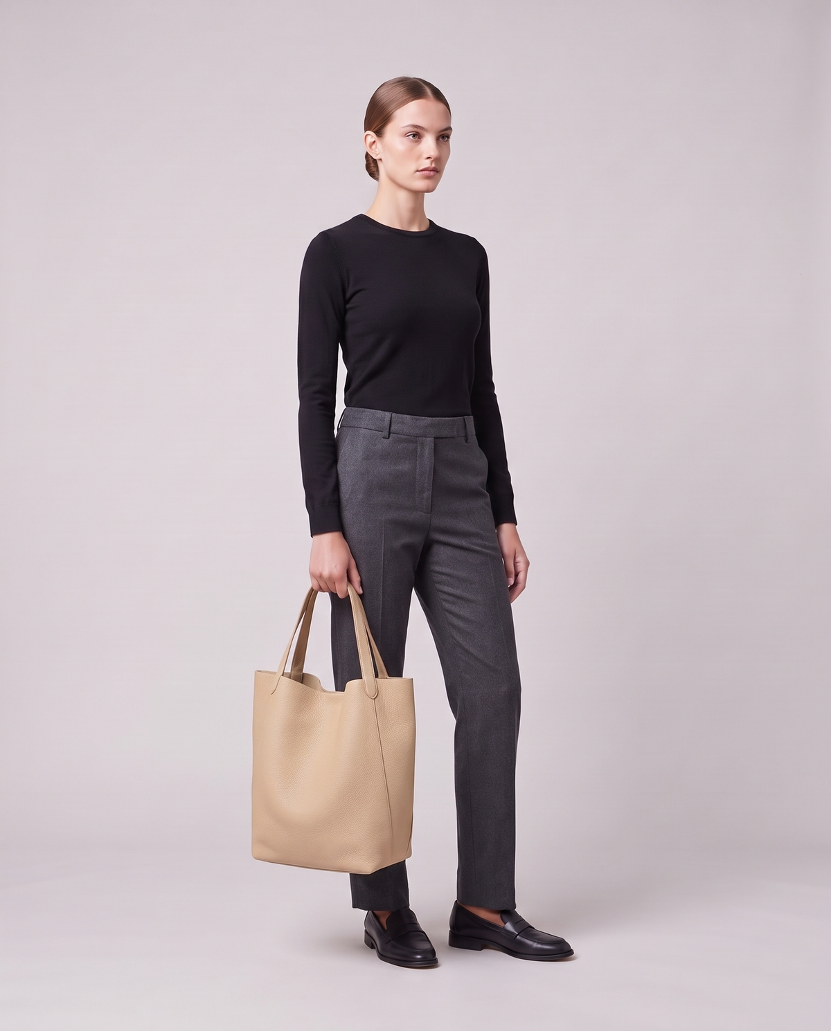 Model holding the Valentina Tela Small bag in Beige, full length